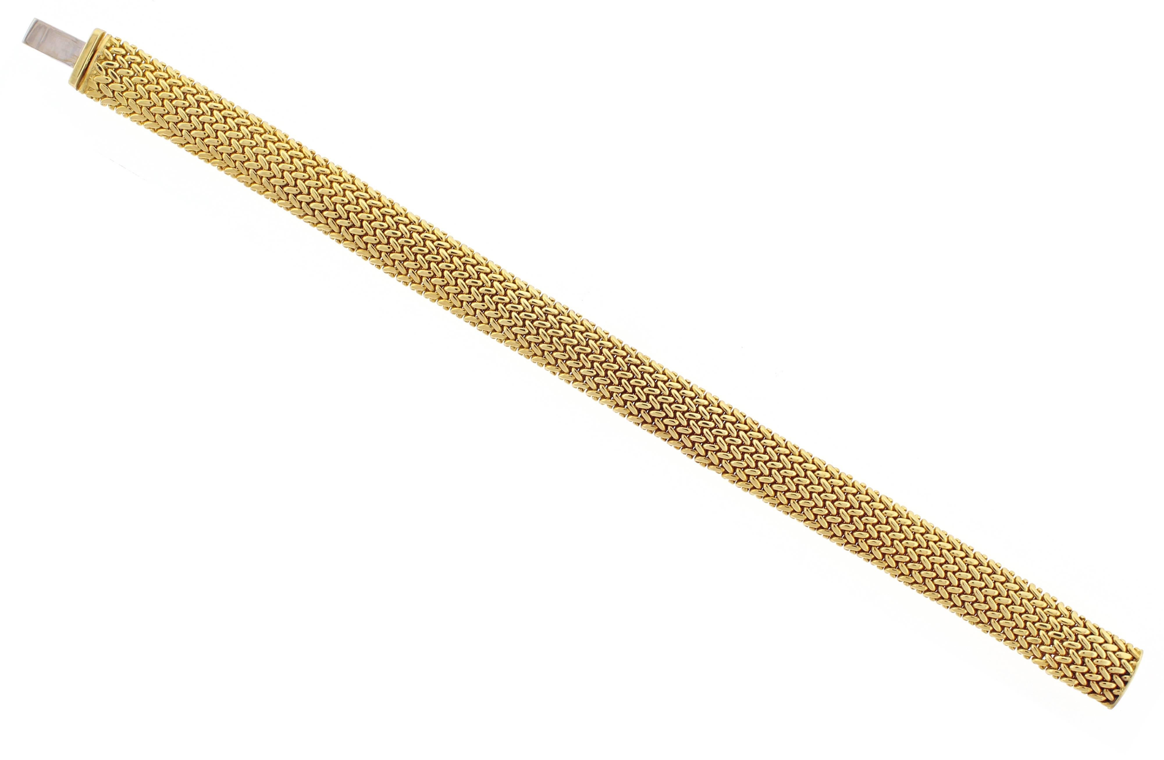 This 18 karat yellow gold Tiffany & Co. Somerset Bracelet mesh bracelet is 10 millimeters in width. 34 grams. 7.25 inches in length