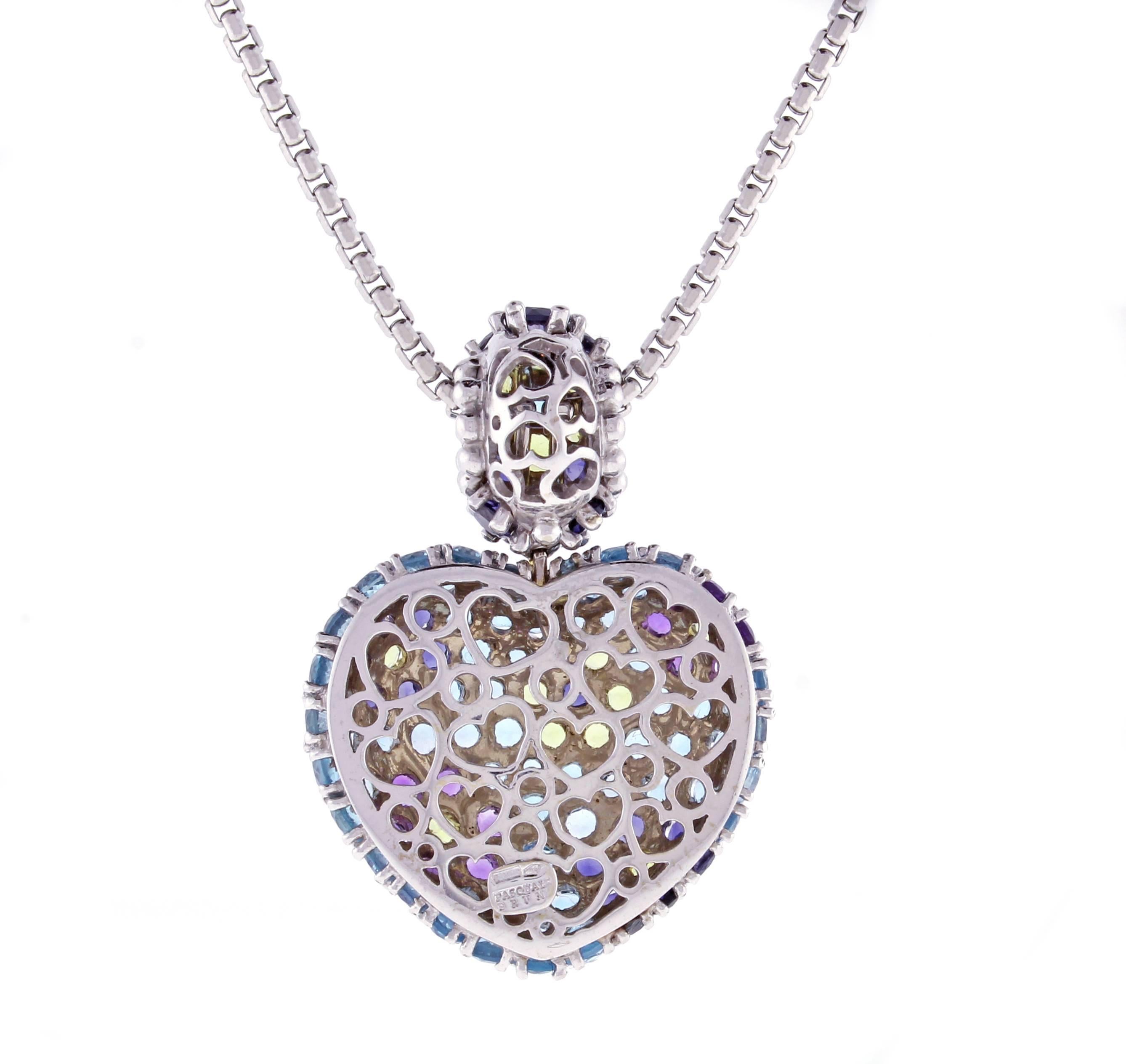 From acclaimed Italian designer Pasquale Bruni, a stunning wide multi gemstone heart pendant. The pendant features vibrate tanzanite, tourmaline, topaz, peridot and amethyst.  Measuring 1¼ of an inch wide and 2¾ of an inch high. Set in 18 karat