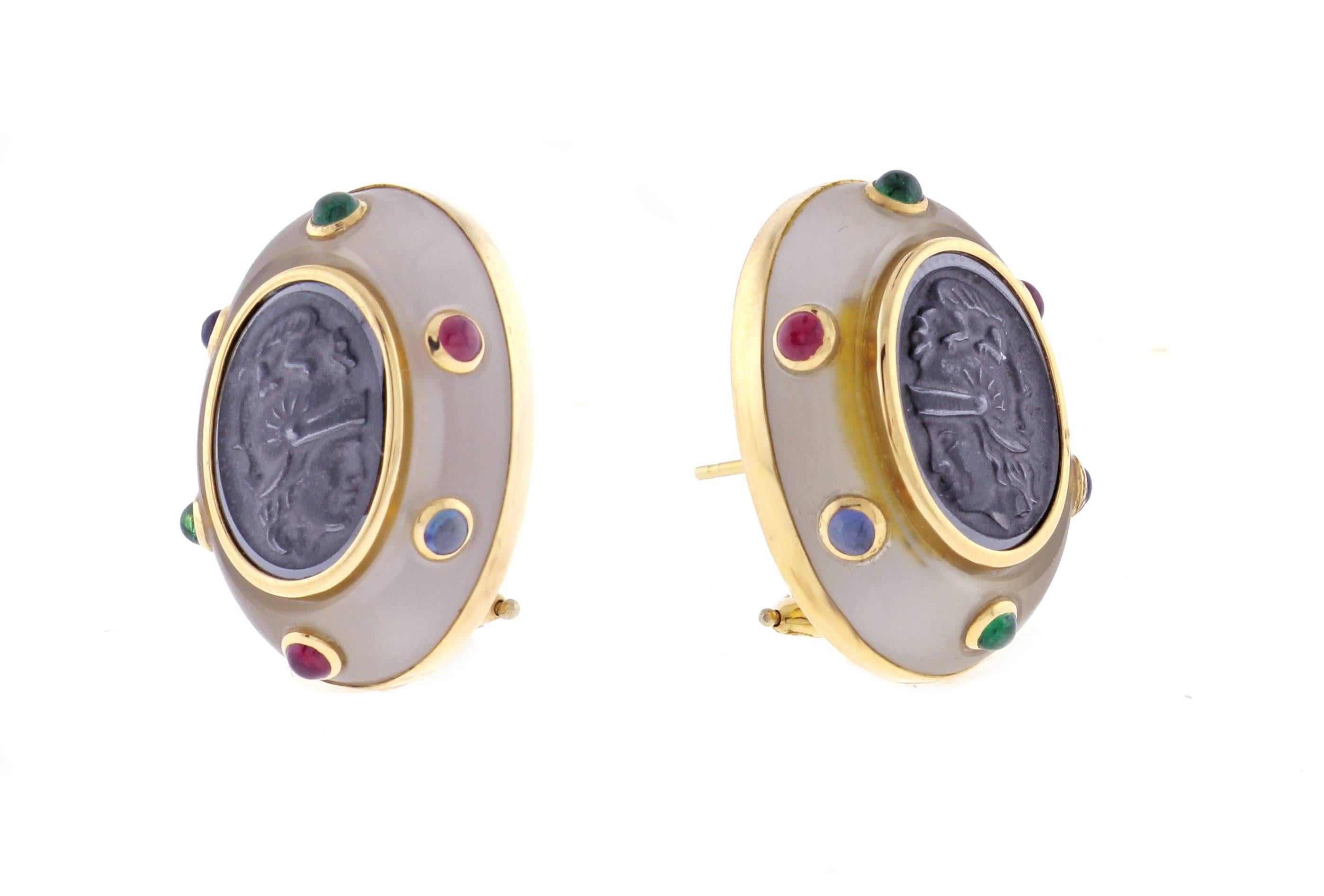 Creating original jewels with unusual combinations of precious and exotic materials has been the hallmark of Trianon for over 30 years. Oval hematite intaglios are framed by frosted crystal quarts embedded with cabochon emeralds rubies and