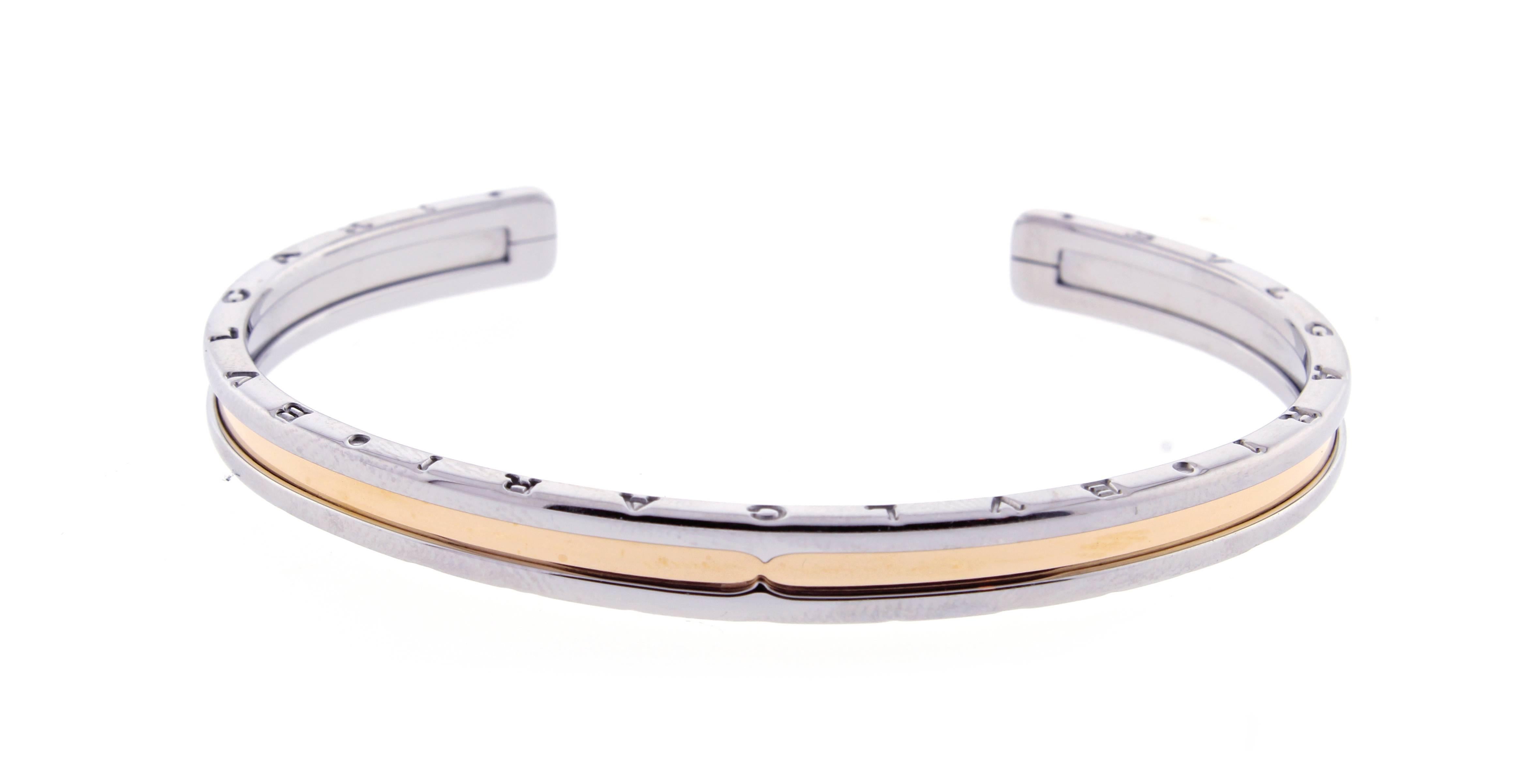 From the Bulgari, B Zero collection, this fantastic cuff bangle bracelet crafted in steel and 18 karat rose gold. Medium size, fits a  six inch wrist