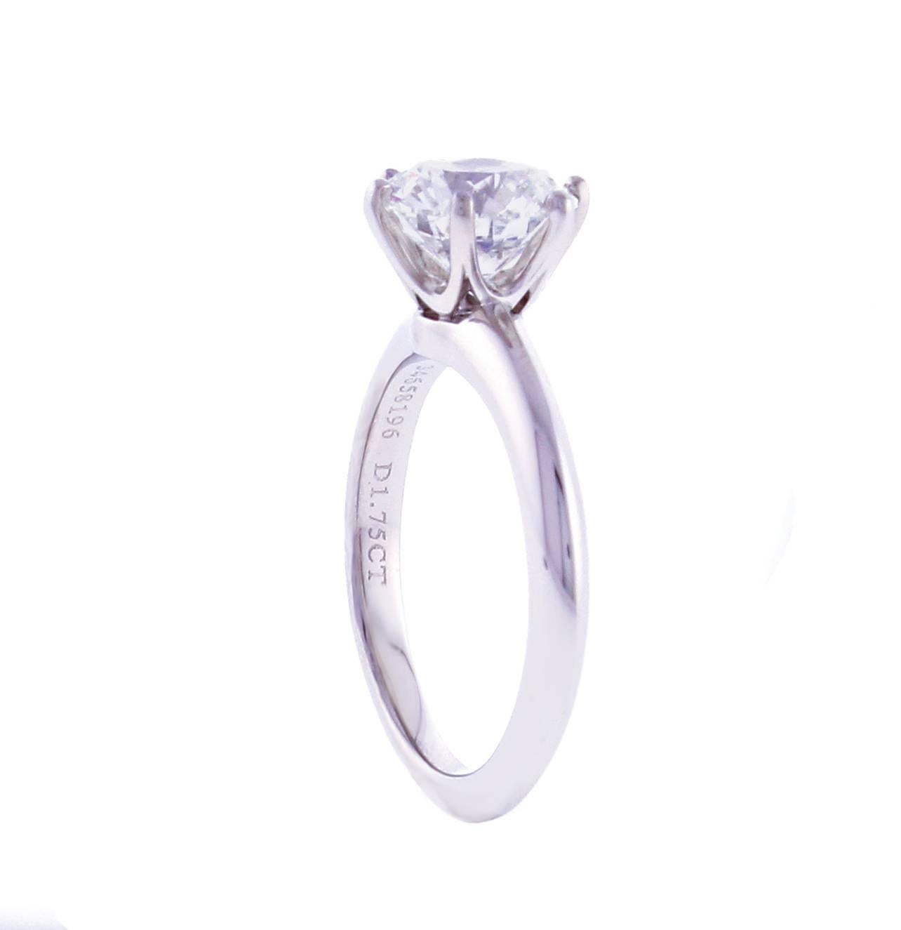 From Tiffany & Co., this brilliant diamond engagement ring. The ring features a 1.75 carat Tiffany diamond. The diamond is H color and VVS2 and is set in the classic Tiffany platinum setting. The ring is accompanied by a Tiffany appraisal and