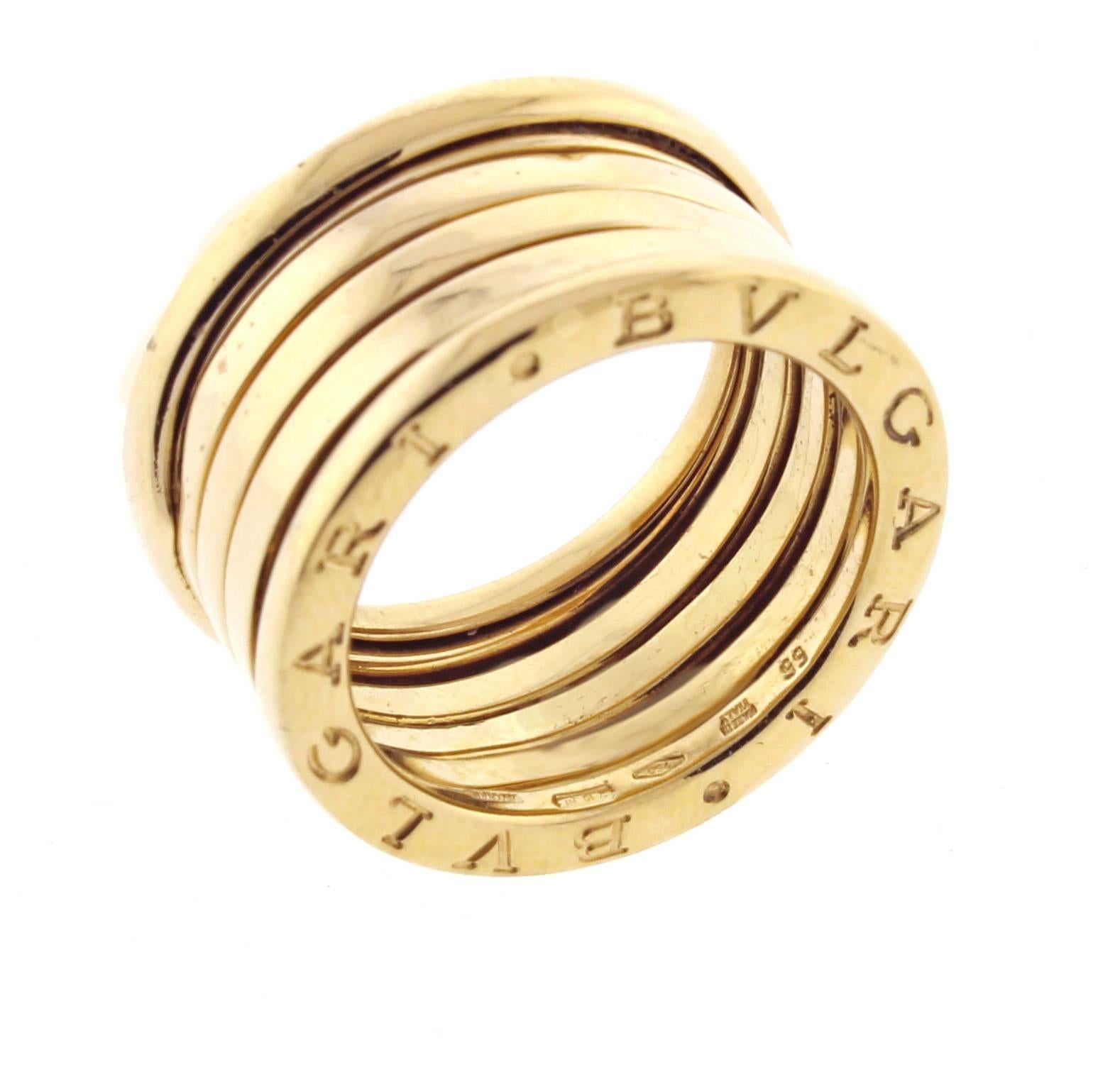 From Iconic Italian designer Bulgari, the classic BVLGARI B.zero1 18 karat yellow gold five-band 12mm Ring. Size 55 7 ¼
 