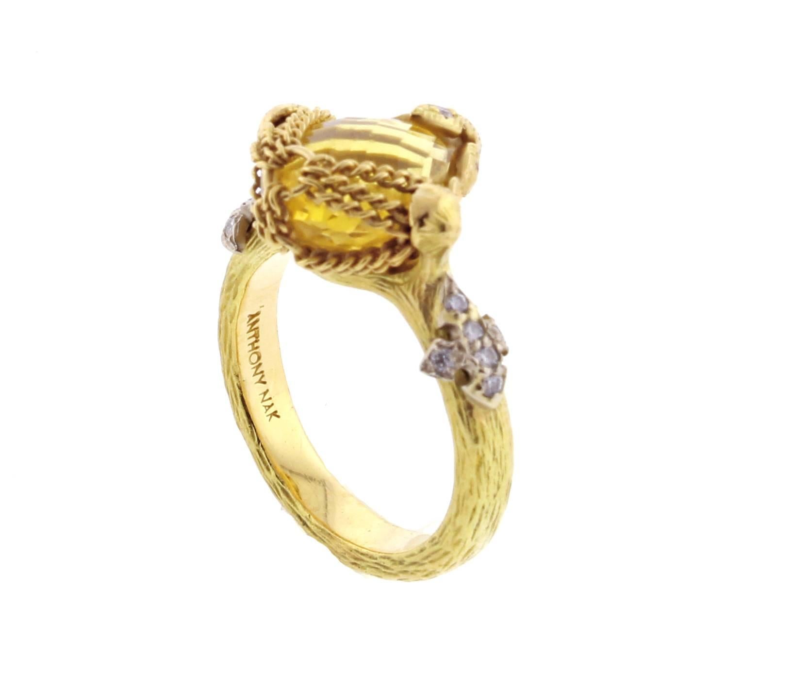 From World-famous jewelry designers Anthony Camargo and Nak Armstrong, these handmade Citrine and diamond ring. The rings is of a center pear-shape  briolette citrine with 13 round diamonds weighing .16. Size 6
