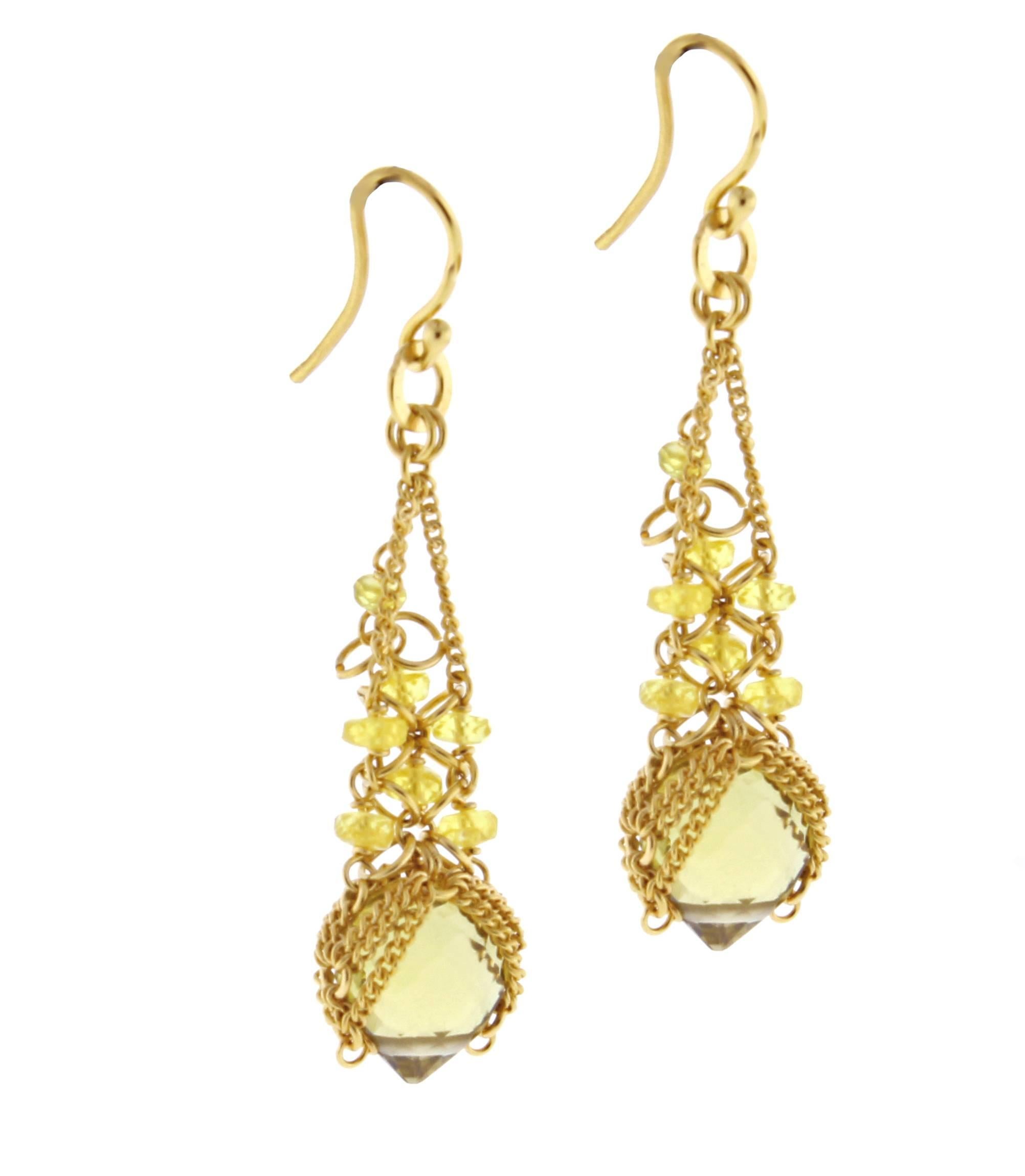 From World-famous jewelry designers Anthony Camargo and Nak Armstrong, these handmade Citrine and diamond earrings. The 18 karat earrings contain center pear-shape briolette citrine and lemon citrine roundels. 1 1/2 inches long 