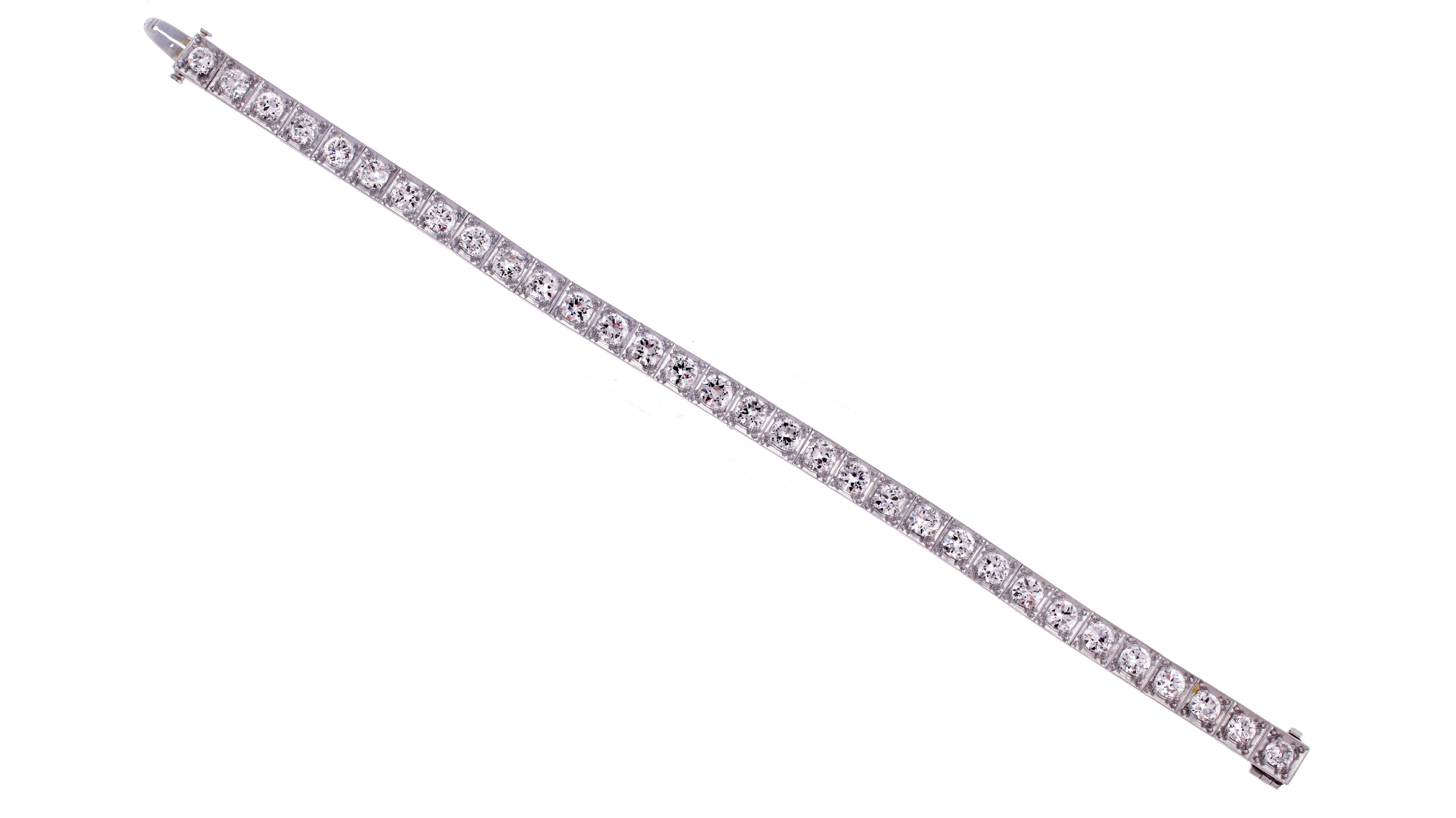 From the 1930s, this exceptional platinum diamond straight line bracelet is comprised of 32 old European cut diamonds weighing approximately 8 carats. The diamonds are G-H color and VS-SI1 clarity. 1/4 inch wide and 7 inches long 