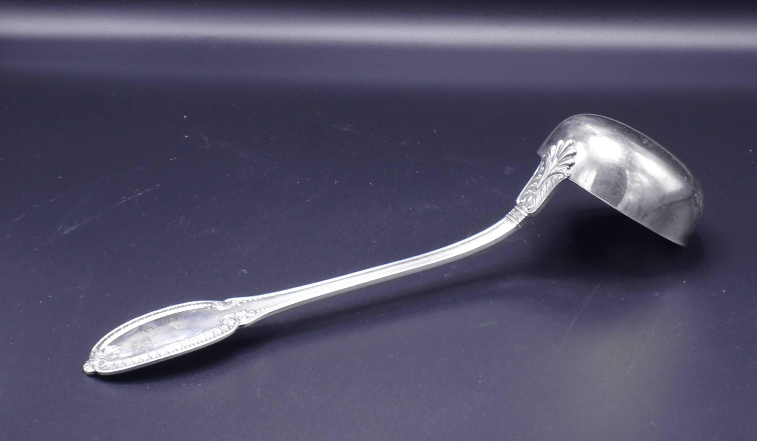 From famed Italian silversmiths Buccellati, a large silver ladle from thier Empire collection.  13 inches long,  310 grams