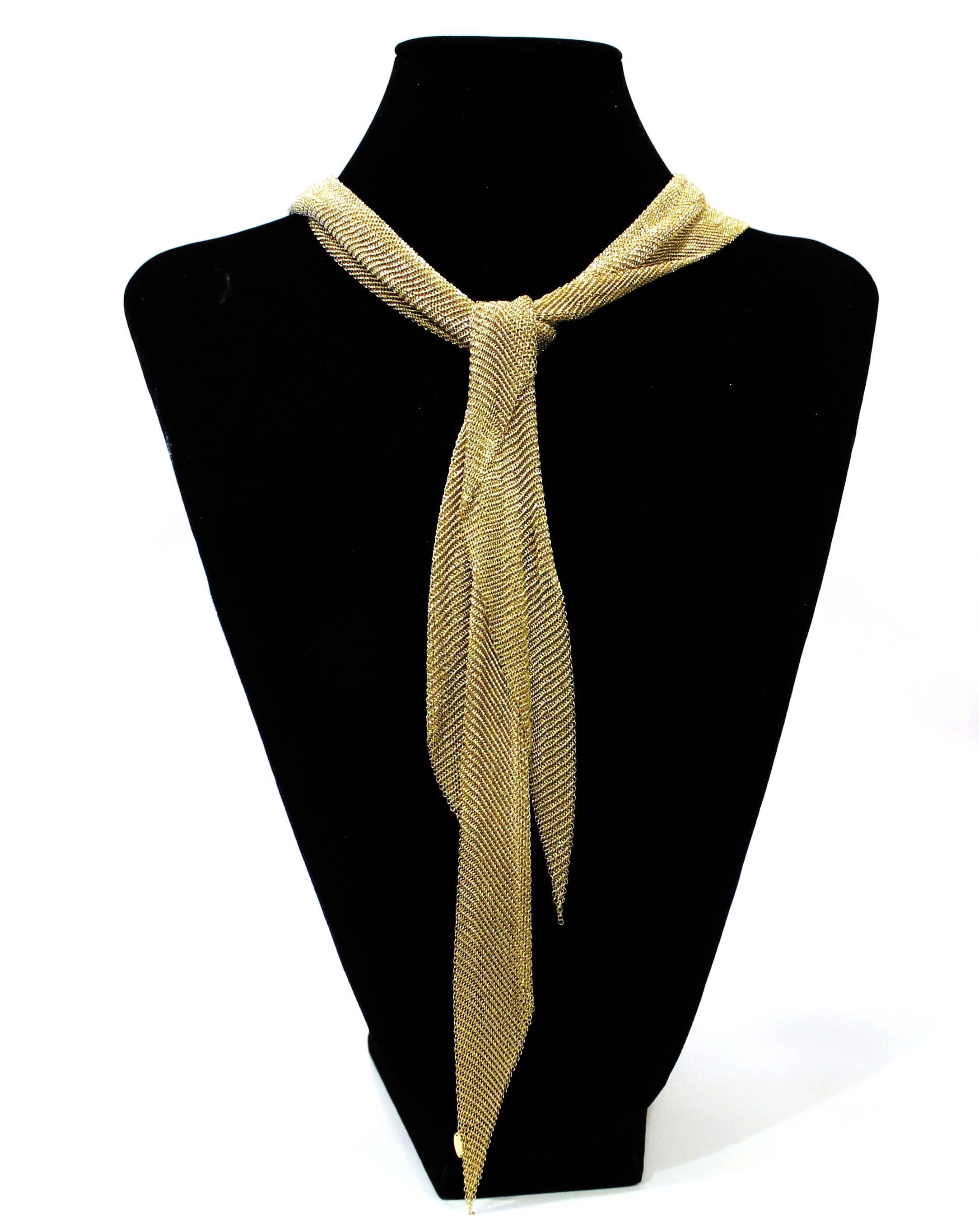 This 18 karat large mesh scarf necklace by Elsa Peretti is malleable and ergonomic in the way it drapes over the body’s contours. 3 inches wide, 42 inches long, 178 grams