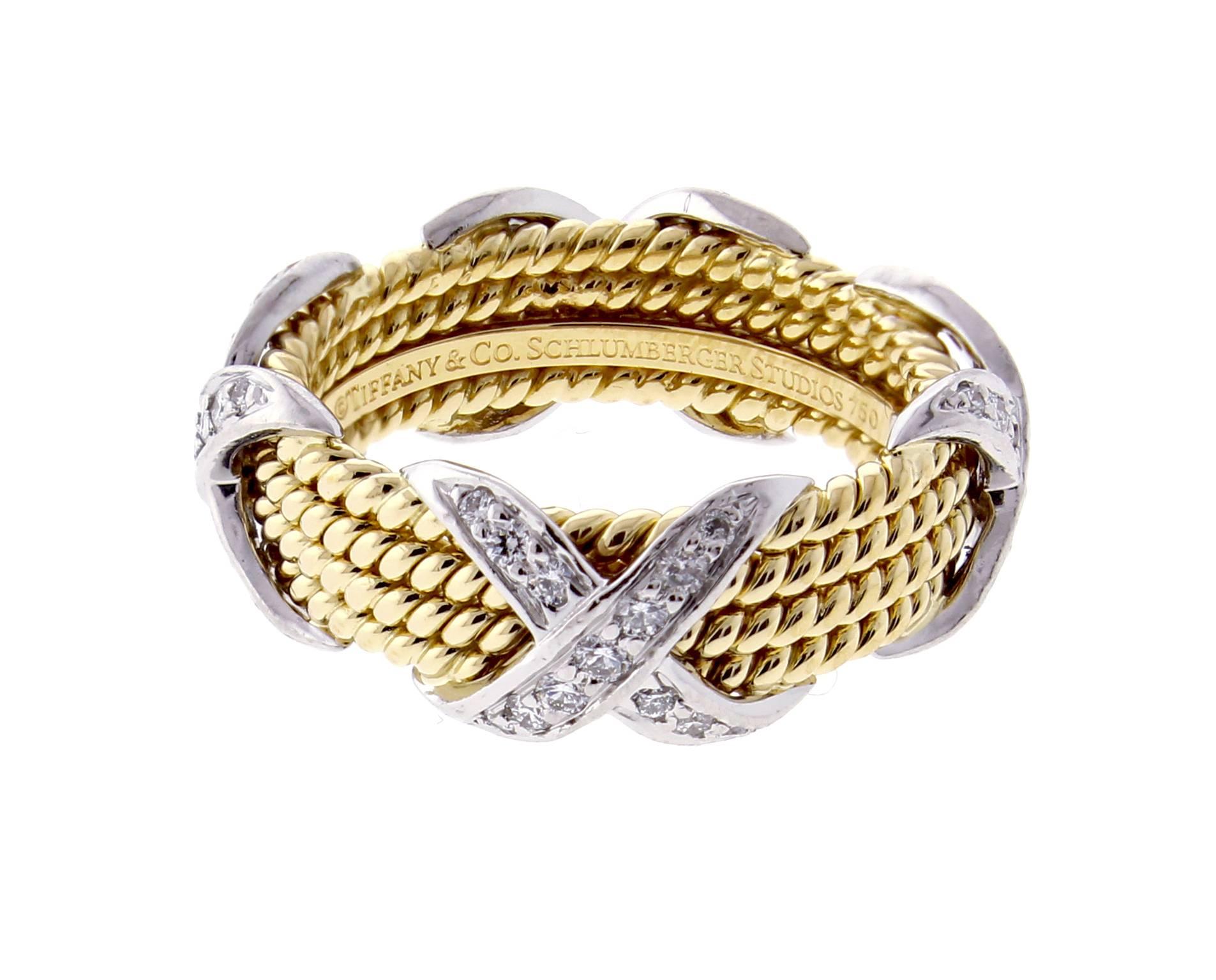 Jean Schlumberger’s visionary creations are among the world’s most intricate designs. Brilliant diamonds illuminate this striking ring.
18 karat and  gold and platinum with round brilliant diamonds weighing .54 carats. Size 7

