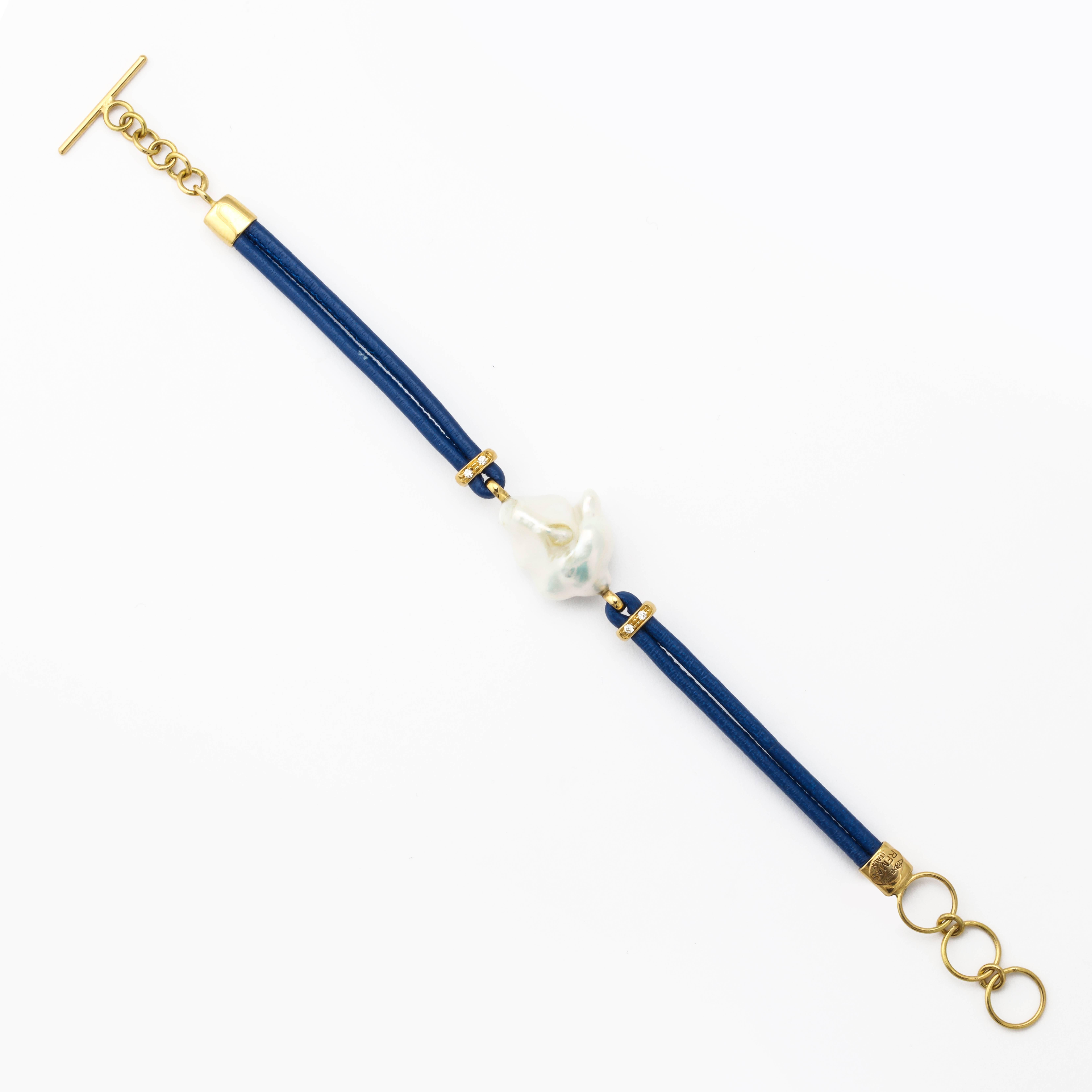 18k yellow gold, freshwater pearl, white diamonds bracelet with navy leather.