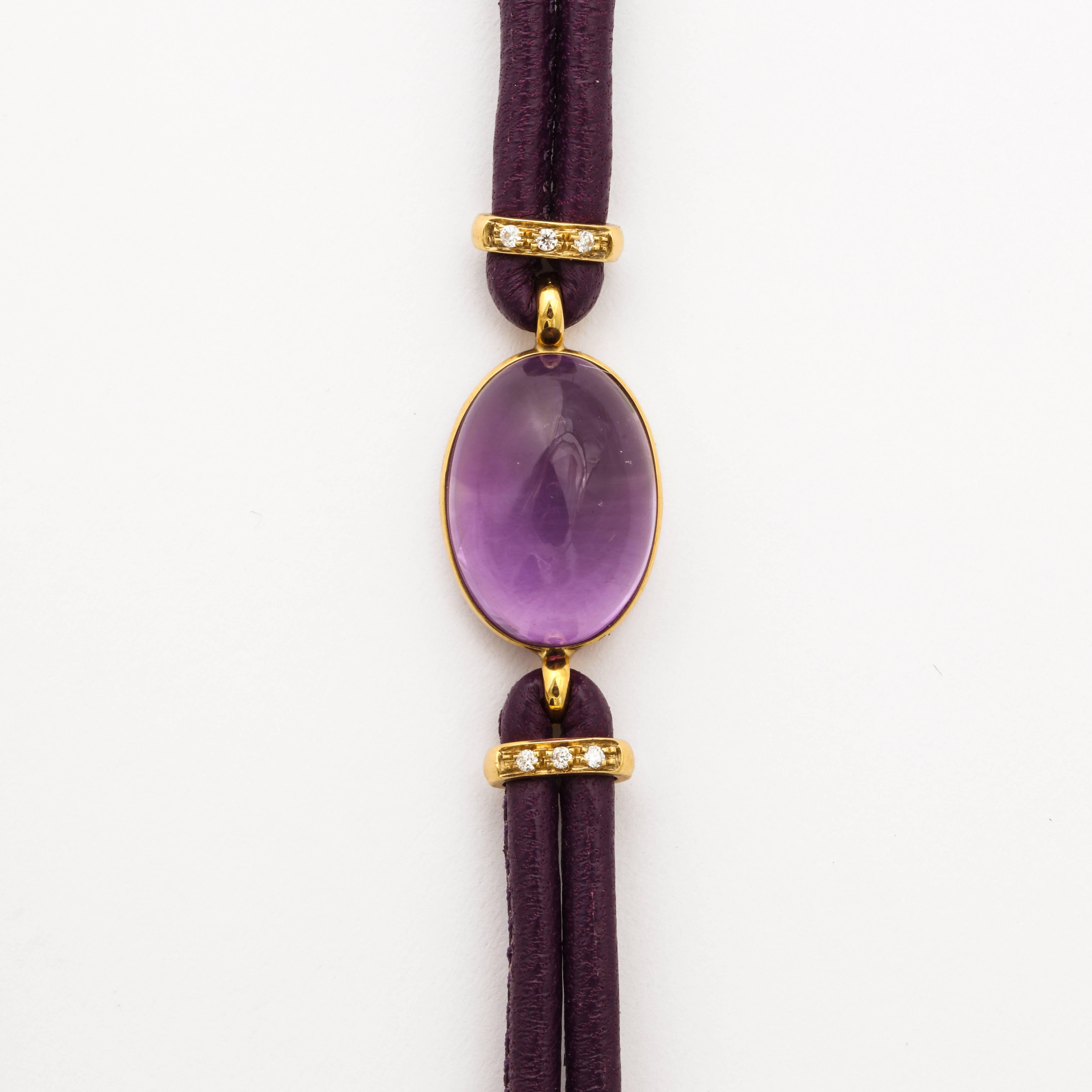 18k yellow gold, amethyst cabochon and white diamonds.