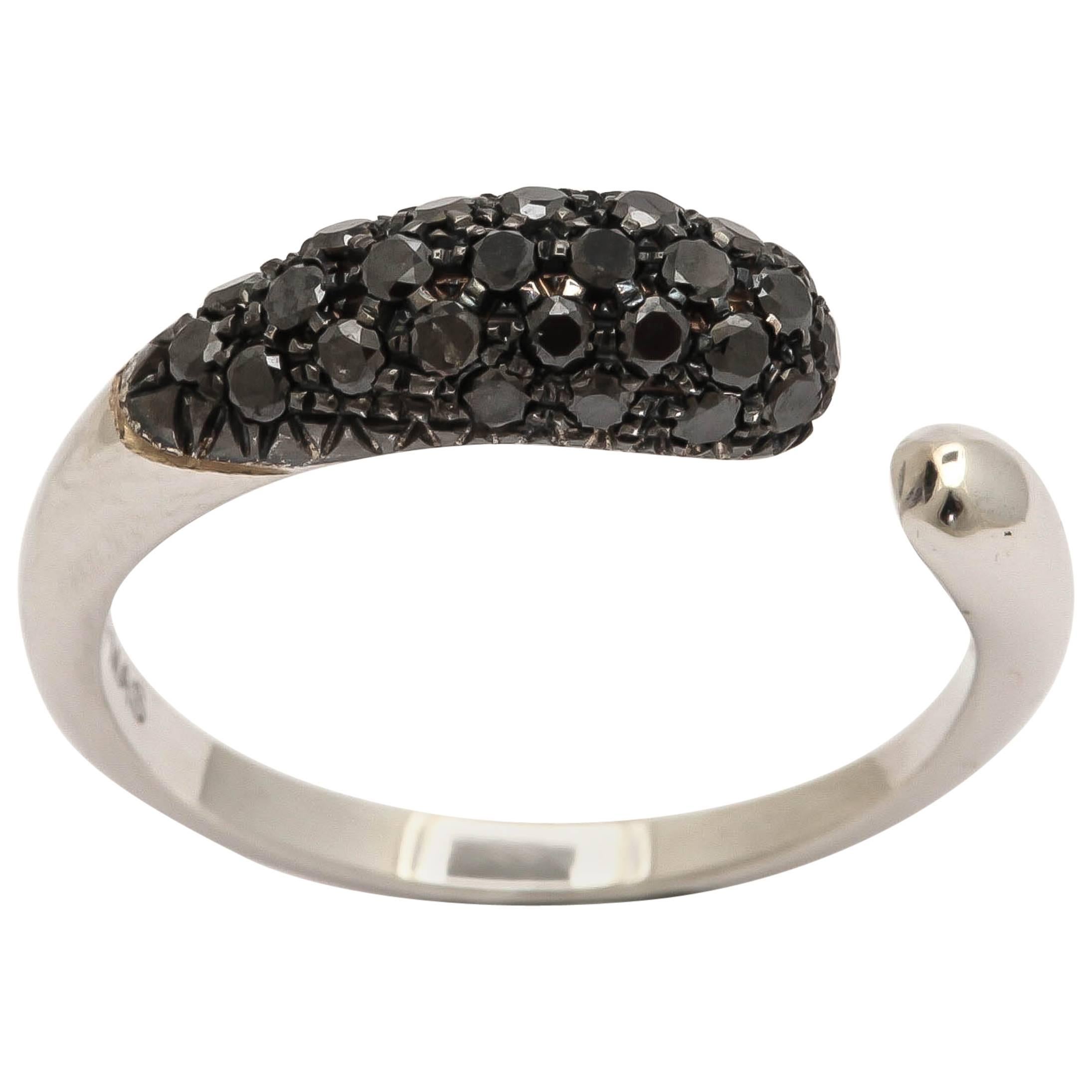 18k white gold gocce ring with black diamonds.