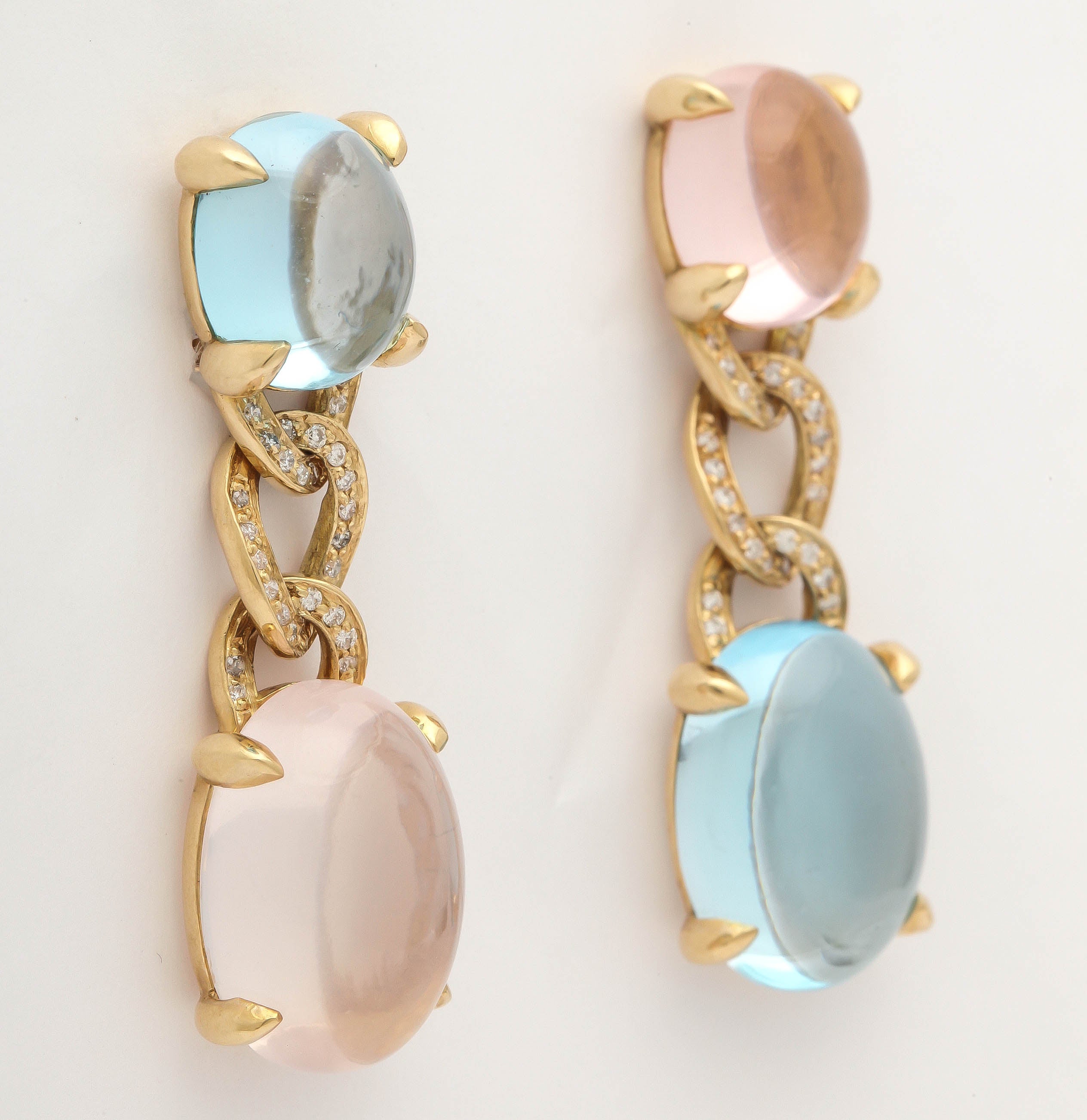 18KT yellow gold earrings with blue topaz, rose quartz and white diamonds.