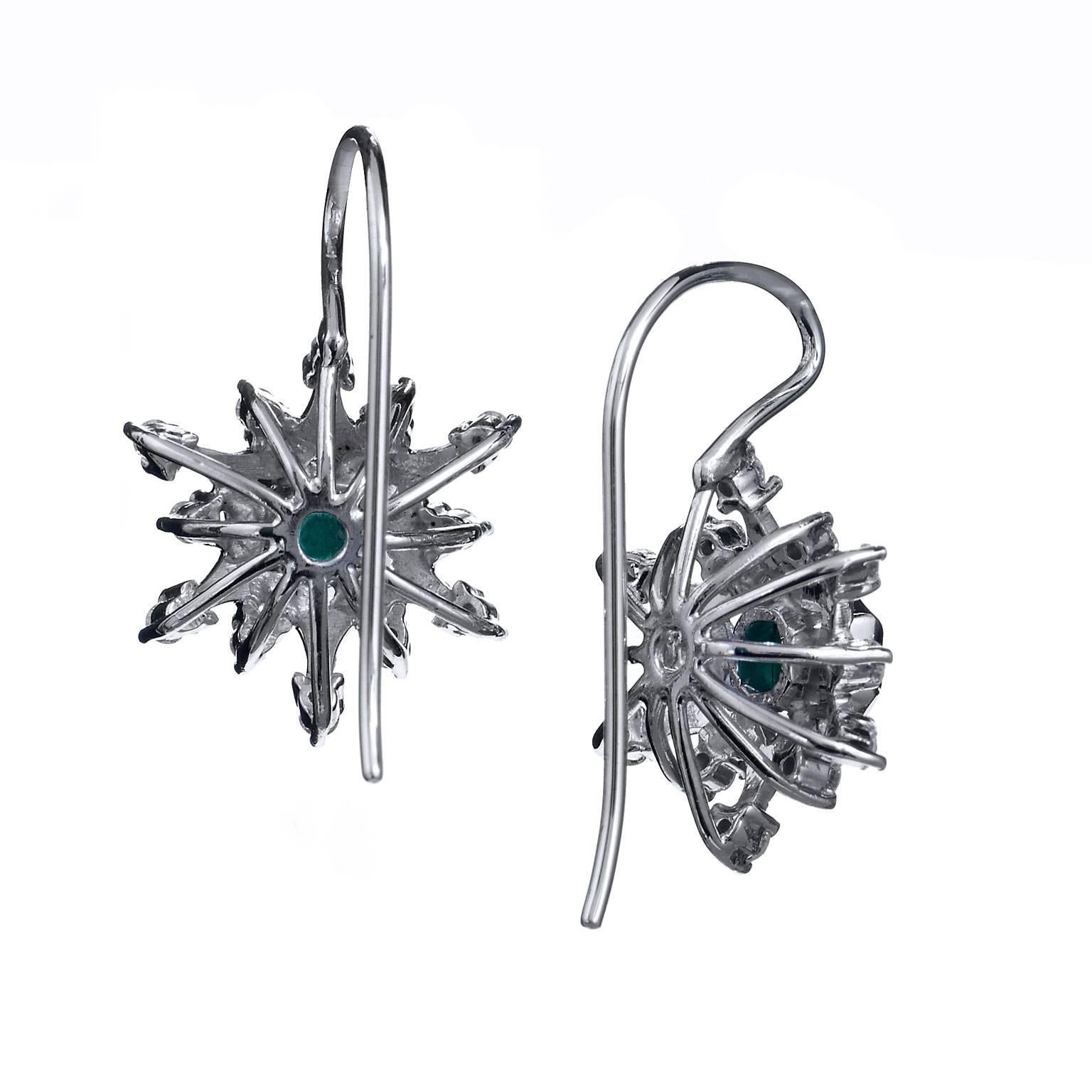 These beautiful hand crafted 18kt. white gold earrings have as their center pieces estimated 0.50 cttw Asscher Cut Colombian Emeralds and adorned with 24pcs estimated 0.25 ct G/H SI1/SI2 Diamond Pave. Let these fashionable drop earrings show her how
