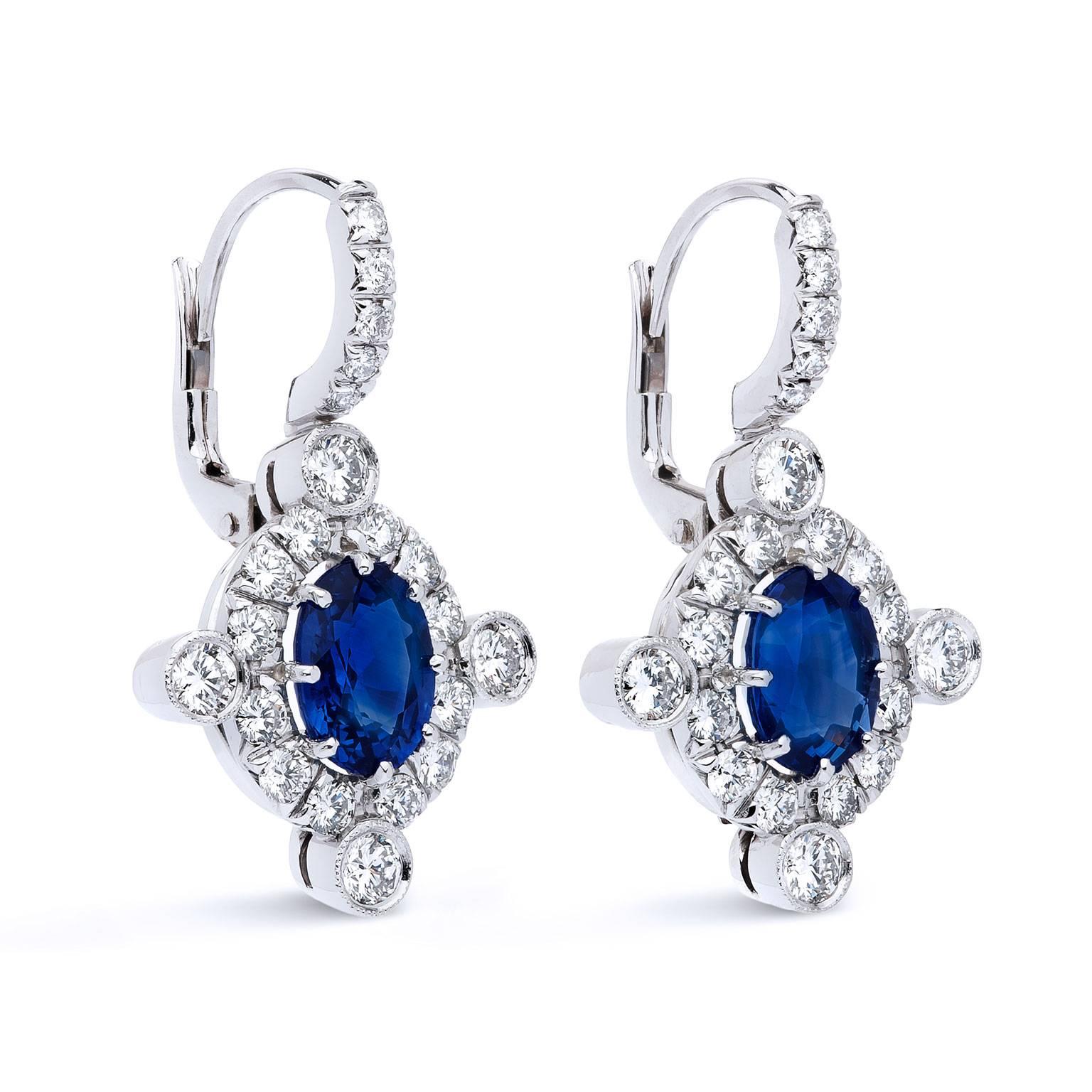 Oval 3.70 Carats Sapphires Diamond Gold Earrings

Eight 18 karat white gold prongs pin oval shaped sapphire gemstones weighing 3.70 carats in this lovely set of hand-made earrings. F/G VS diamonds create a pave perimeter around the oval sapphires,