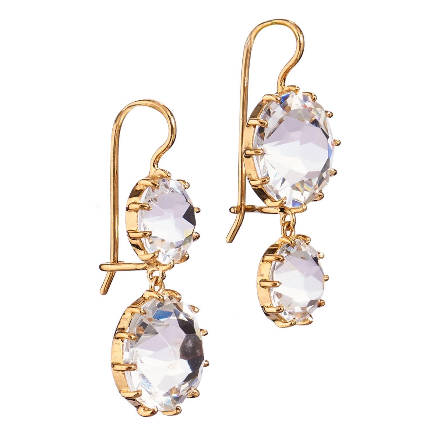 Signed by American designer Renee Lewis these 18 karate yellow gold earrings feature 10 mm and 7.5 mm Rock Quartz Stones set in prongs. The inverted design allows for motion of the bottom stones to scintillate spectacularly catching the eye and