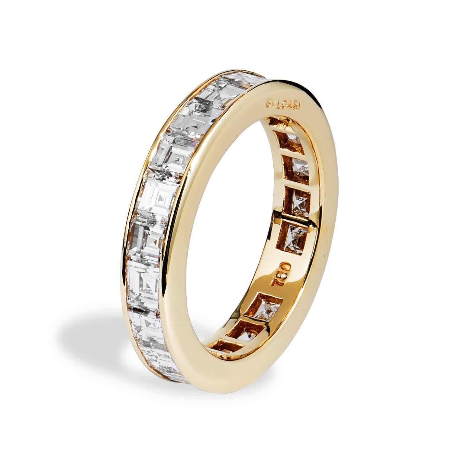 Classic and clean , this Italian designed Bulgari Diamond All Around Wedding Band in Eighteen Karat Yellow Gold, features twenty one (21) step cut 