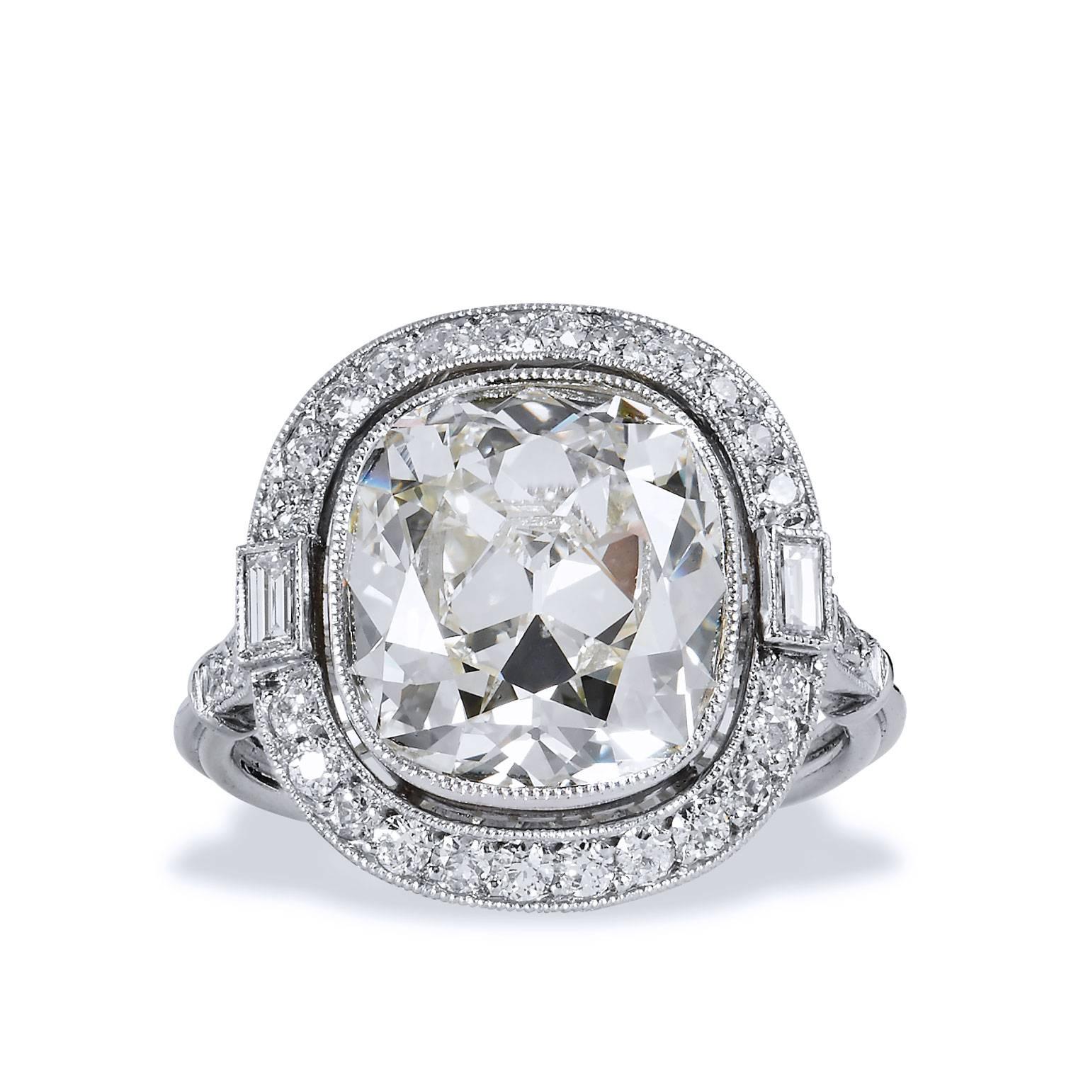 GIA Certified 6.53 Carat Cushion Cut Diamond & Modern Old European & Baguettes 

This gorgeous 6.53 carat diamond ring of platinum scores the highest marks. It is S-T in color and has a clarity of SI1.
Designed and manufactured by H&H Jewels which