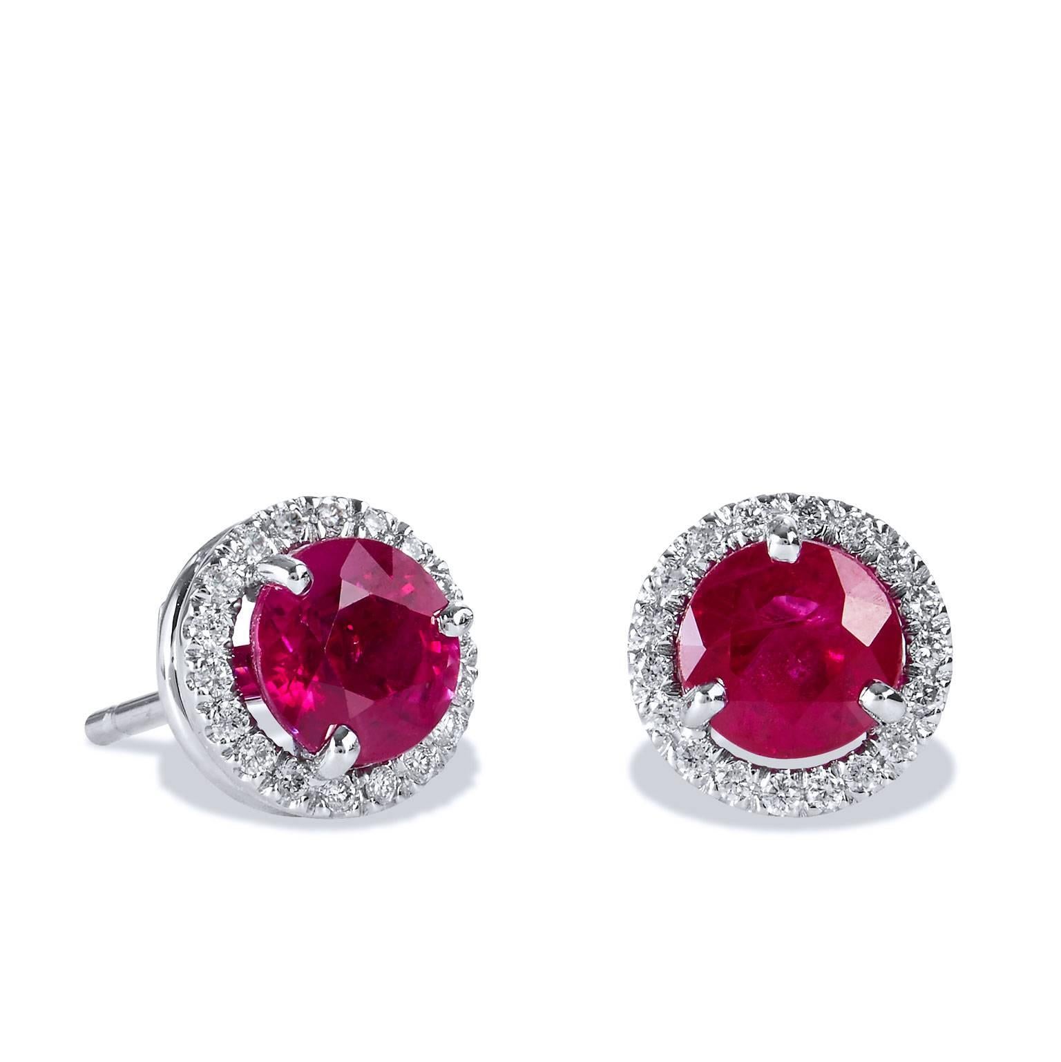 These impeccable 2.08 carat Burma rubies are embraced by 0.13 carat of pave-set diamond and fashioned from 18 karat white gold.  These handmade stud earrings are an original H & H design and are the perfect combination of beauty and