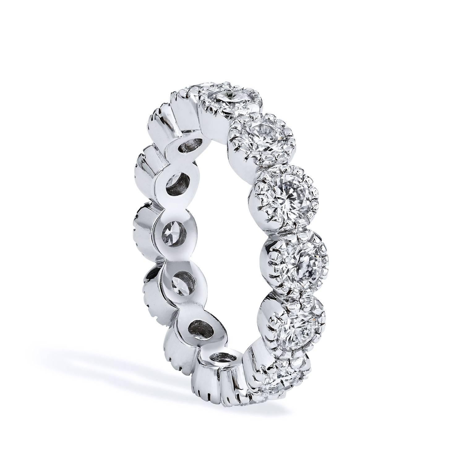 H&H Designed Wedding Band Created in platinum , with ten round brilliant cut diamonds encircling the finger. Each Diamond surrounded by a ring of platinum seeded in place by ten prongs.  Total Diamond weight of 1.70 Carats, the diamonds pop with