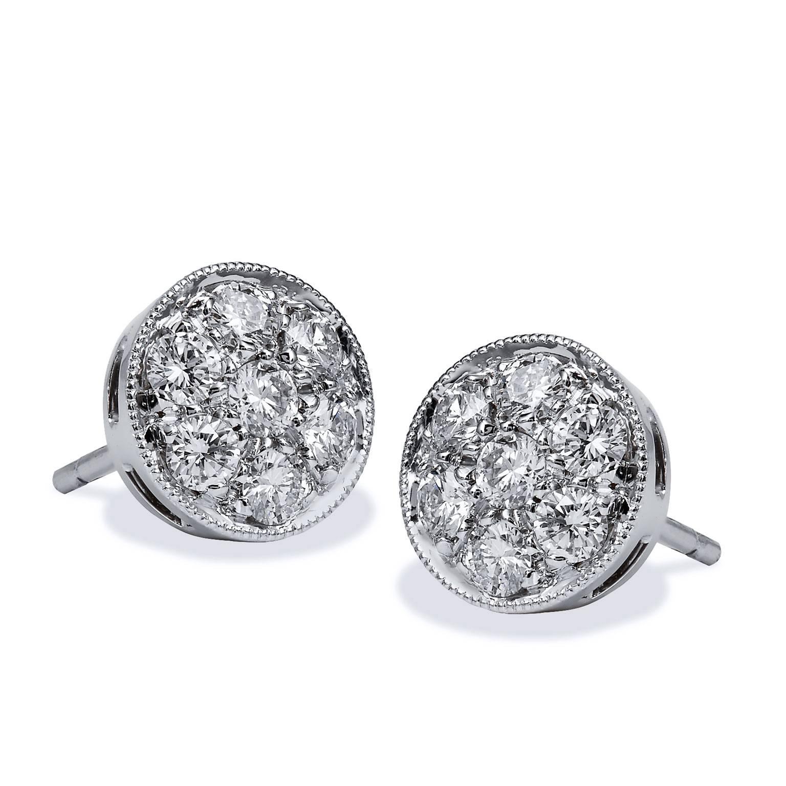 The Perfect button Earring- They will take you from home to office to evening
Eight Millimeter in Diameter, manufactured in eighteen karat white gold with fourteen round brilliant cut diamonds which are pave set
with a beaded edge. 
The Diamonds