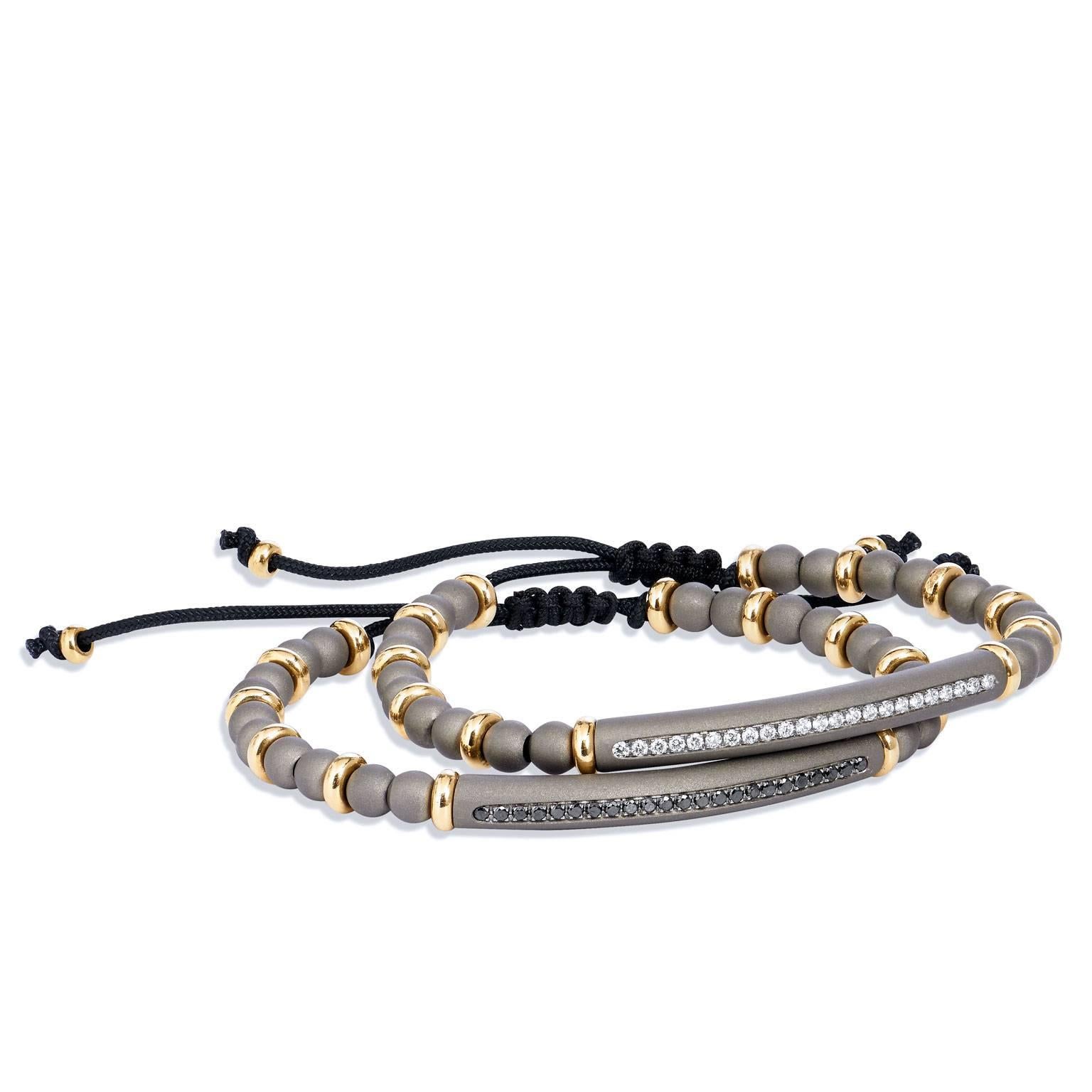 Stylish & Chic Flexible Bracelet combining Titanium,  Eighteen Karat  and Diamonds
Designed with twenty titanium beads, separated by eighteen karat yellow gold spacers, with a titanium bar containing twenty three diamonds weighting one third of