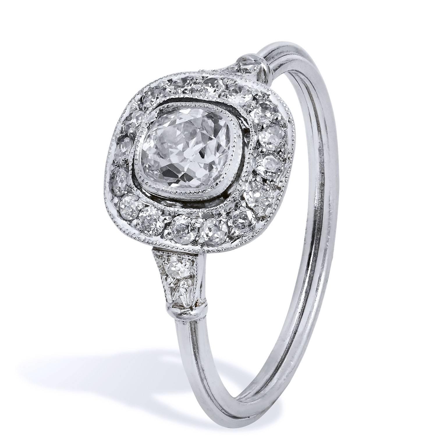 This handmade platinum engagement ring features a 0.44 carat old mine cushion cut diamond at center (J/VS2), with eighteen pieces of old European diamonds pave set (J/VS2; total weight: 0.23 carats) with milgrain work accentuation at both the center