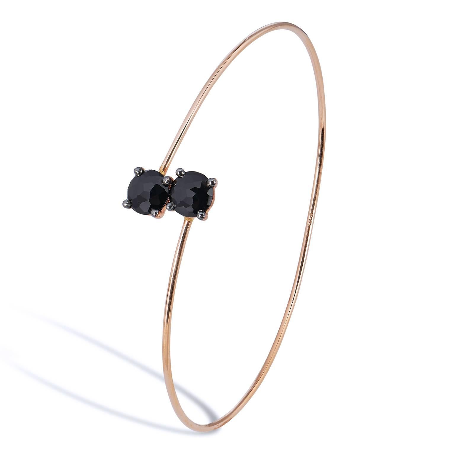 Suzanne Kalan Black Spinel 14 Karat Rose Gold Wrap Around Bracelet

This beautiful 14 karat rose gold wrap around bracelet is so easy to wear.  
It has two 6 mm round cut black spinels in a prong setting. 
This sleek and sophisticated bracelet is by