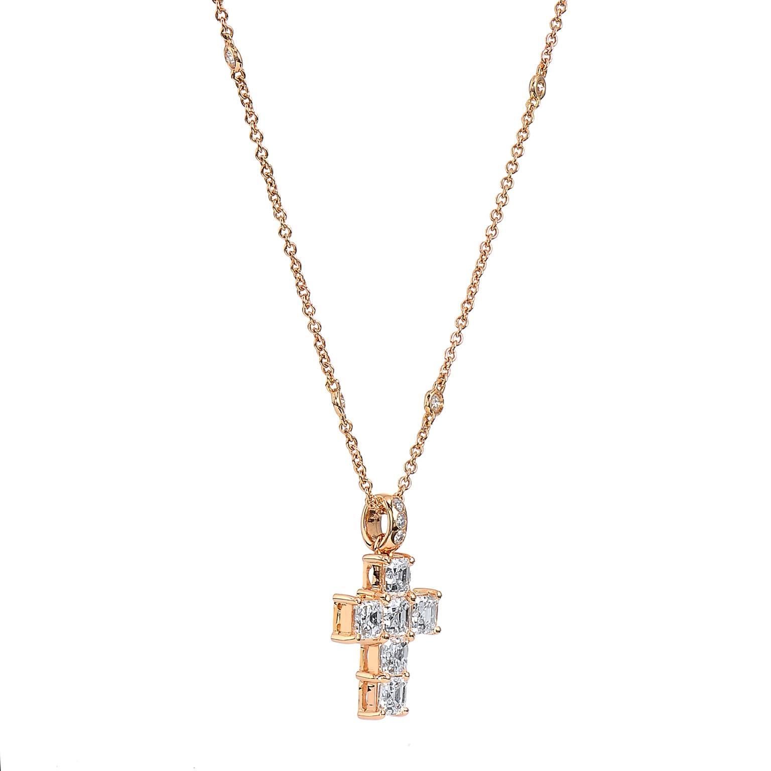 The contrast between the rose gold of the metal and the white diamonds are striking in this cross. With 1.90 carat of Asher cut diamonds prong set in cross shape and 0.29 carat of diamond bezel set scattered throughout the length of the chain, this