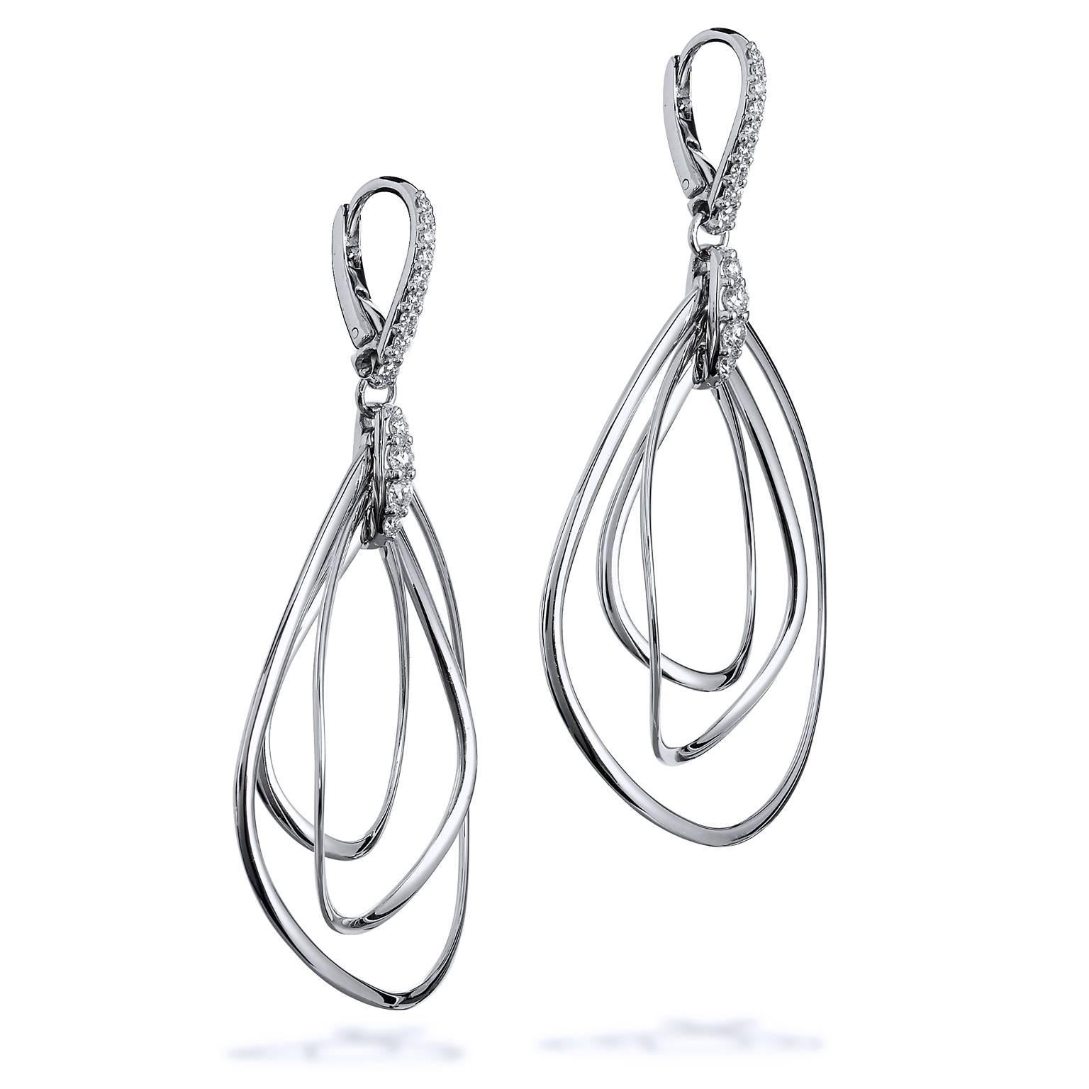 18 karat white gold drop earrings featuring a total weight of 0.62 carat of diamond pave set (G/SI).