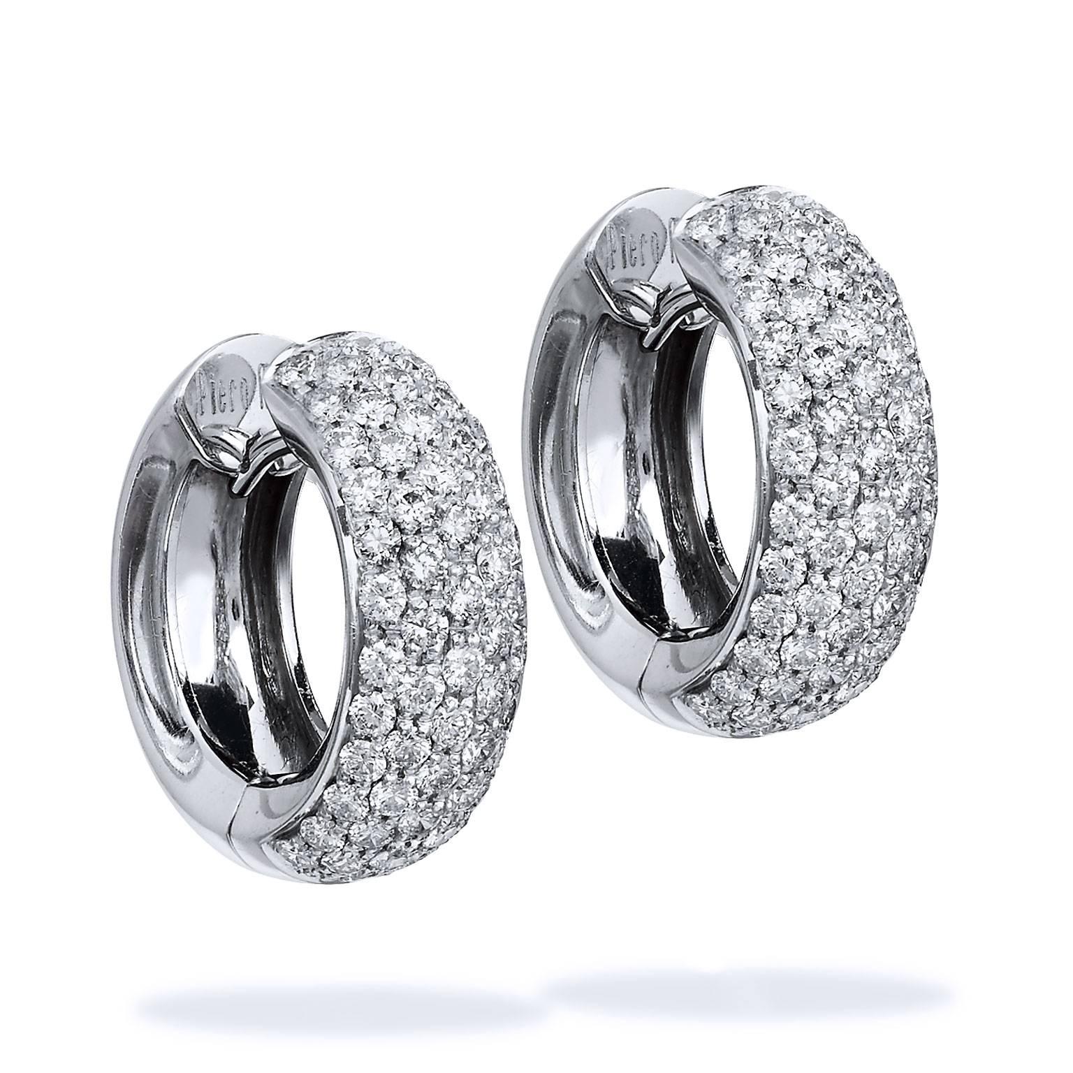 Wide Diamond Pave White Gold Huggie Hoop Earrings

These stunning earrings diamond earrings are so beautiful! The pave diamonds really sparkle and pop! 
The measure 20 mm in diameter and are 7 mm wide. The front half is covered in diamonds, the back