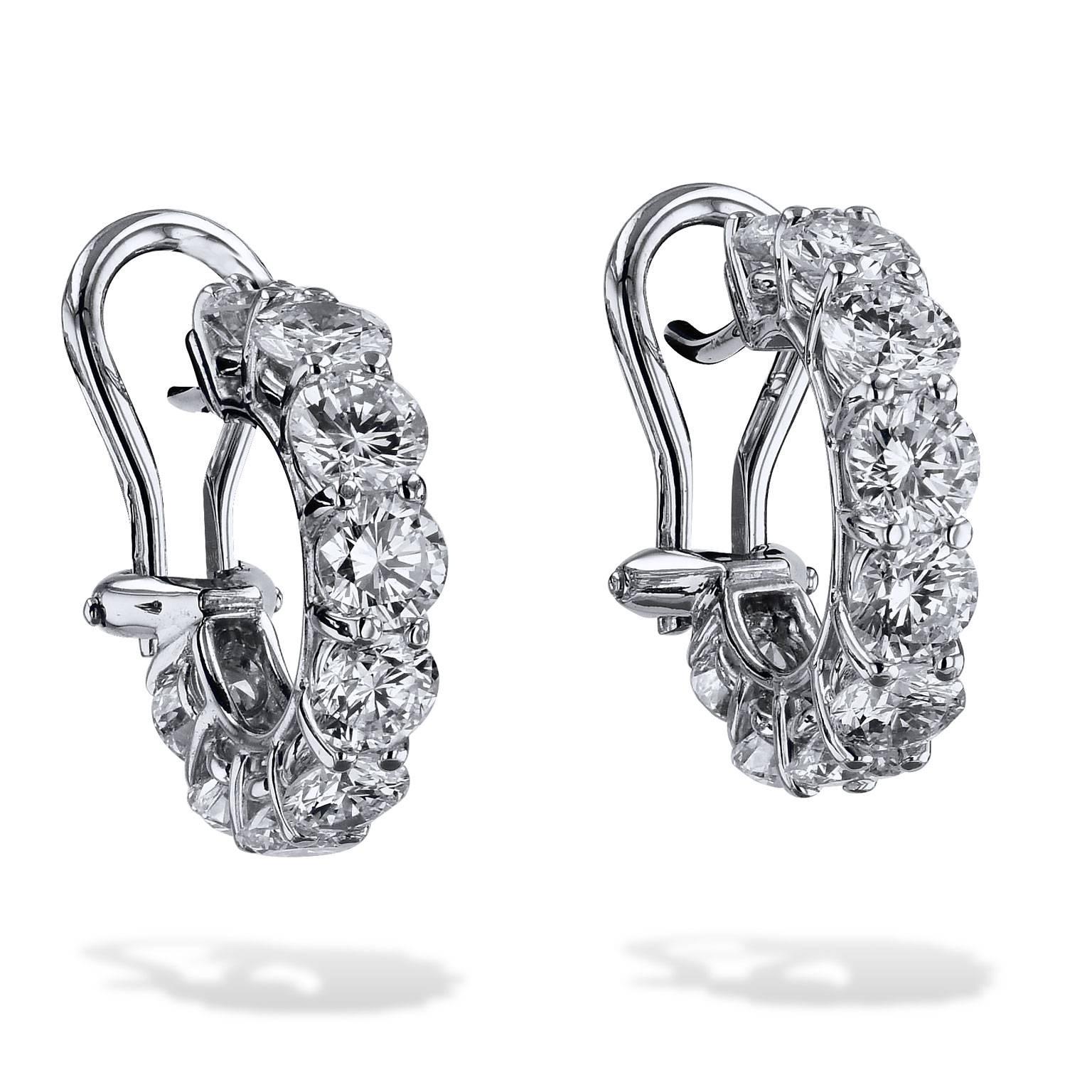 Fashioned in 18 karat white gold and handmade by H, these diamond lever-back hoop earrings feature 4.03 carat of prong-set round diamond and each stone weighs 0.22 carat on average. Get lost in the shine and shimmer of these hoop earrings.