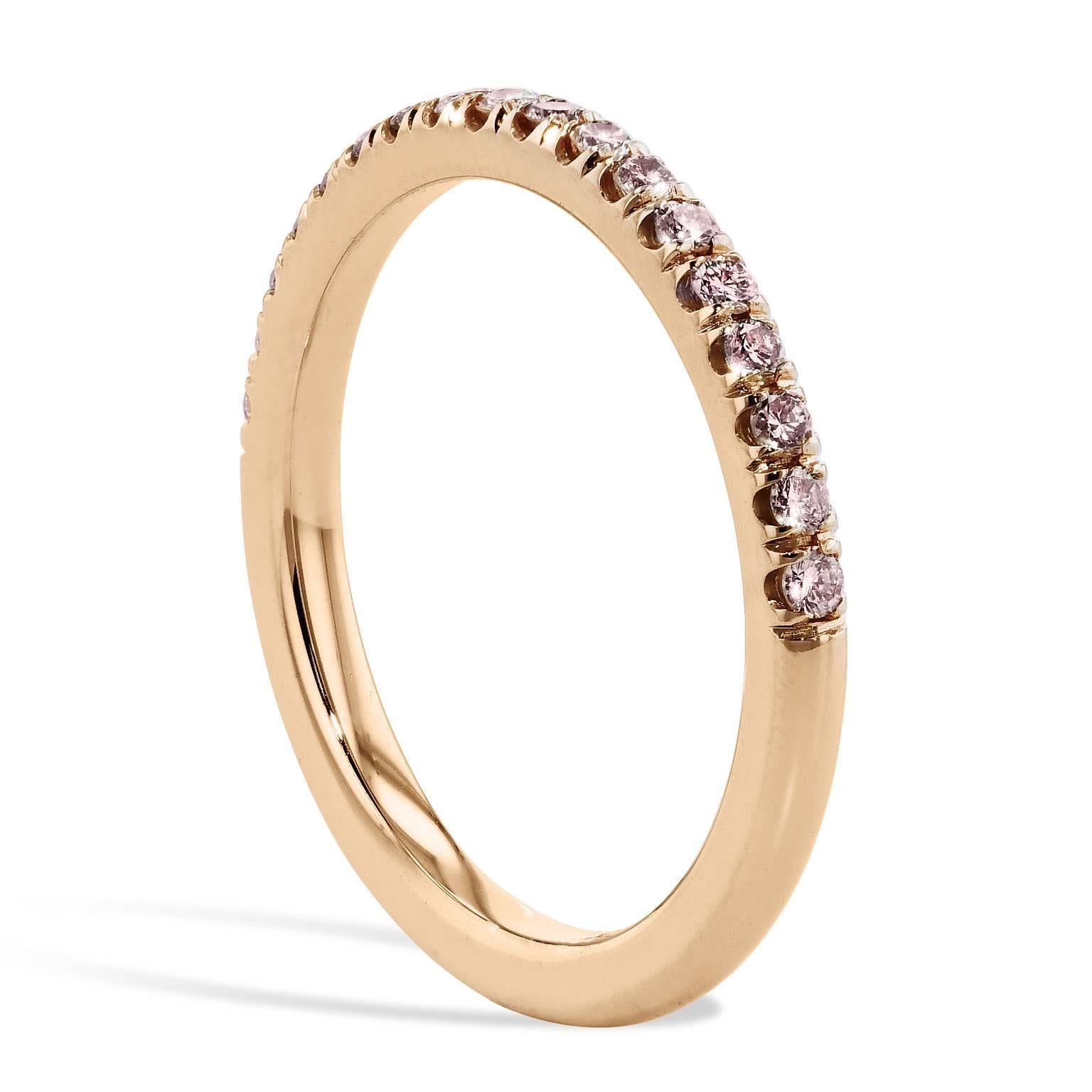 This diamond band ring features natural light pink diamonds pave set with a total weight of 0.26 carat (VS2/SI1). Affixed to a 14 karat rose gold band, the split V detail, opens the eye, and allows the ring to pop with light (Size 6.5).