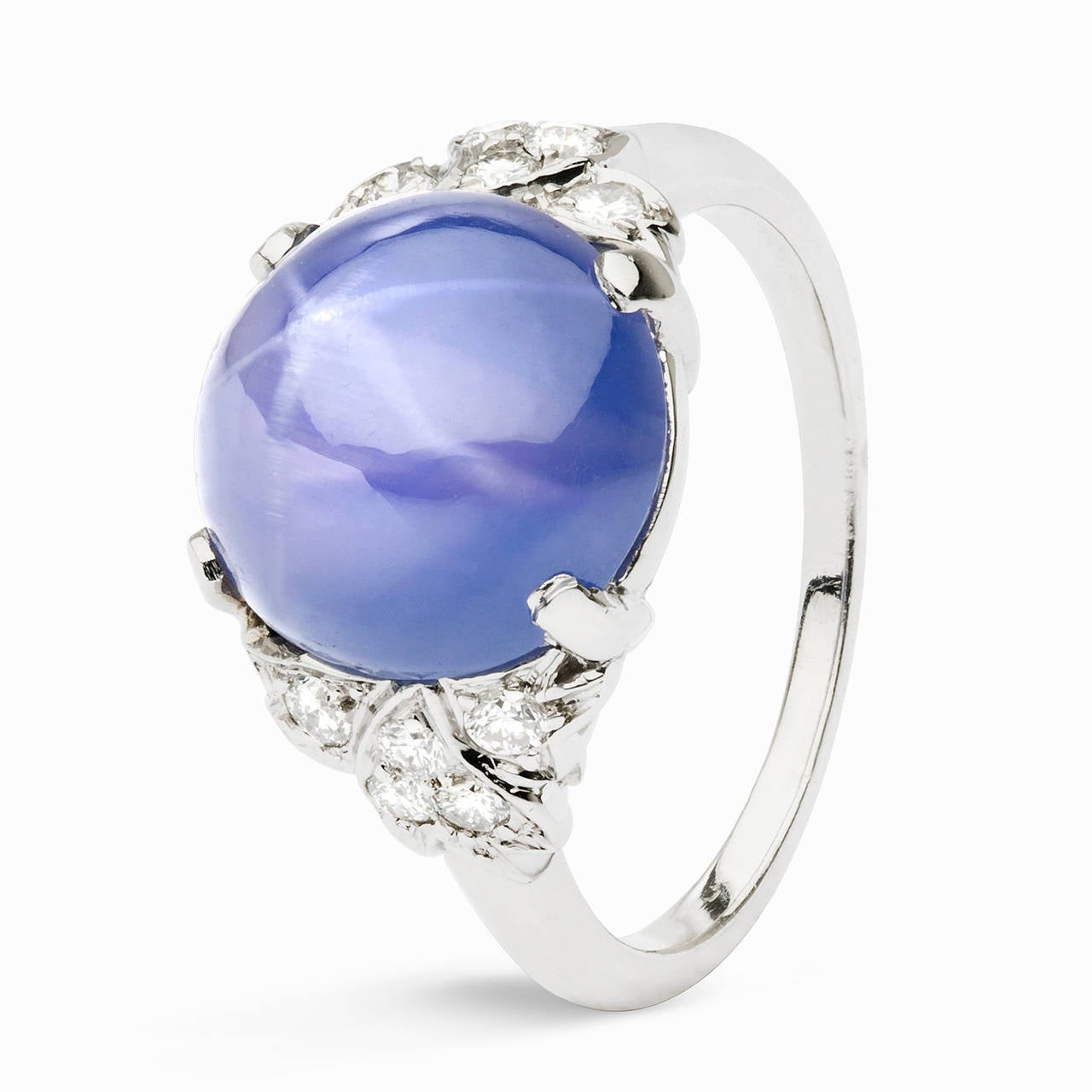 There is a reason why the term “stargazing” was punned and this blue star sapphire is it. “Stargazingly” beautiful, this unique 900 platinum ring features an approximate 10.84 carat star blue sapphire that is perfectly prong set in the center with