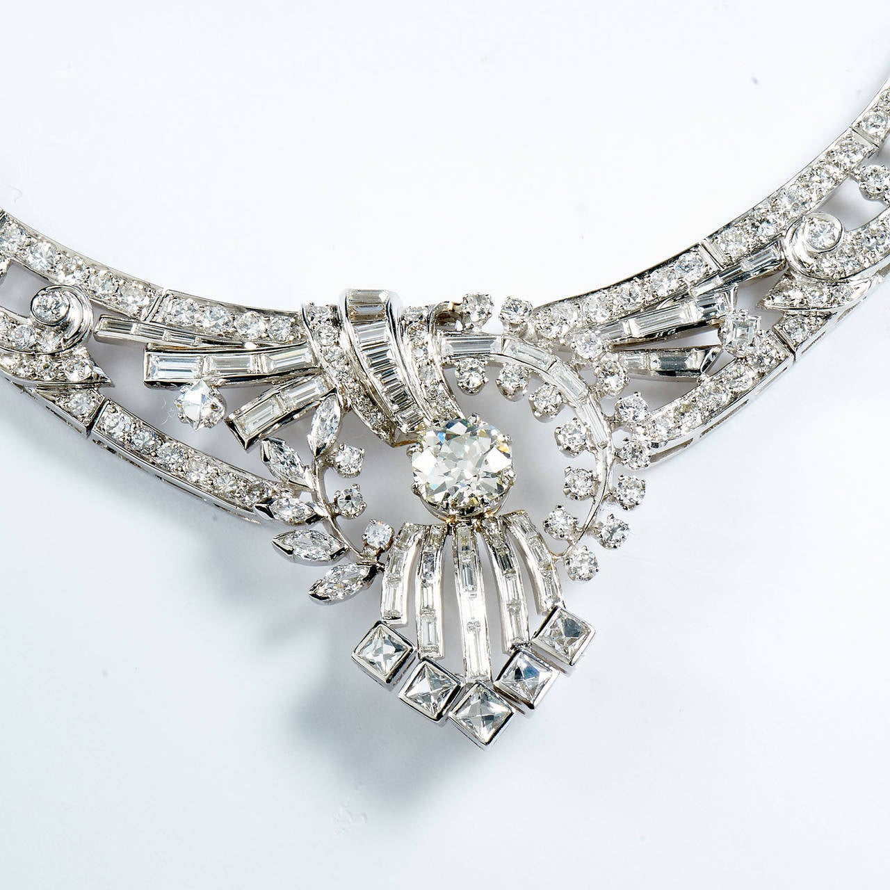This statement piece stimulates the senses and transports one to the glamour of the Great Gatsby. Dropping you into a scene of elegance showcasing meticulously dressed party guests wearing white gloves while sipping champagne under that stars at one