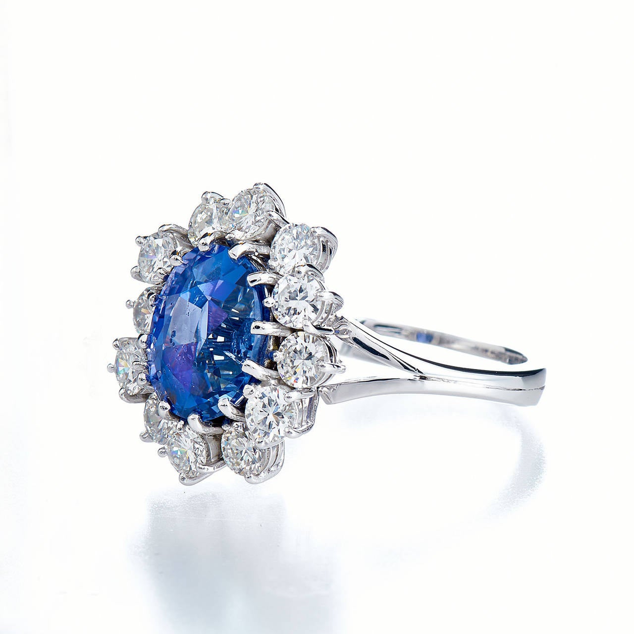 A true definition of natural beauty. This no heat  4.84 carat violetish blue sapphire is an untainted gift from mother nature featuring clarity, color and purity that can not be replicated.  Even more unique to this piece, it exhibits color change