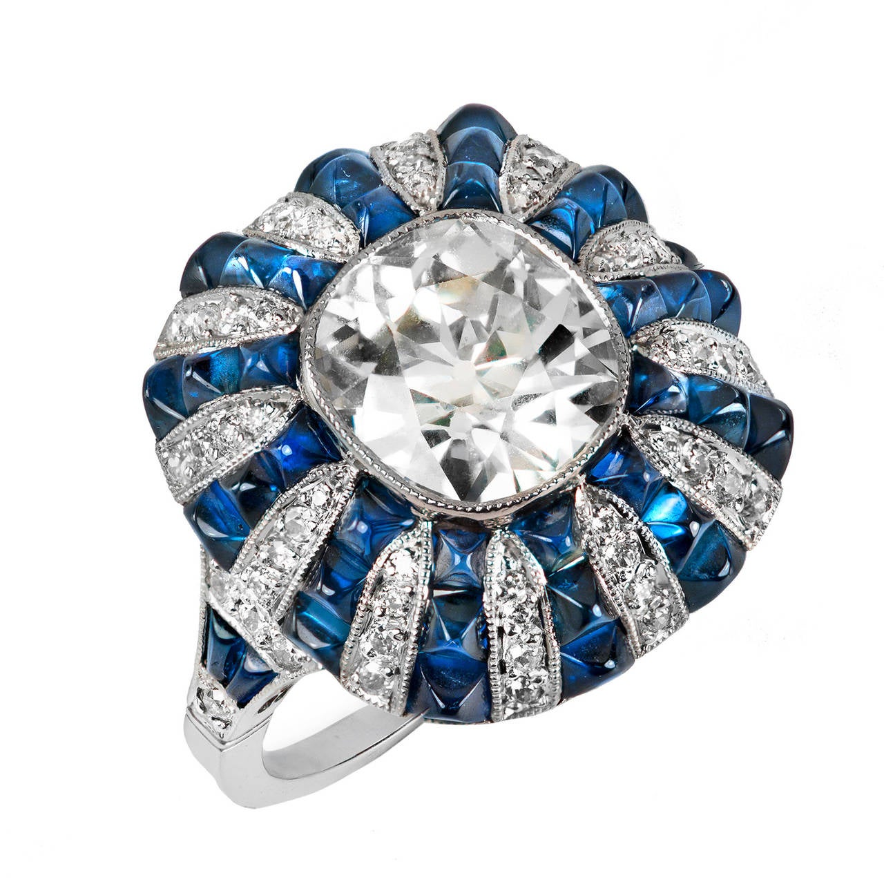  GIA CERT 2.63 Carat Diamond and Sugarloaf Cut Sapphire Platinum Cocktail Ring

This certified cushion cut diamond and plump Sugarloaf cut sapphire Art Deco inspired ring exudes an aura of inspiration from the Art Deco era. At 2.63 carats, its S-T