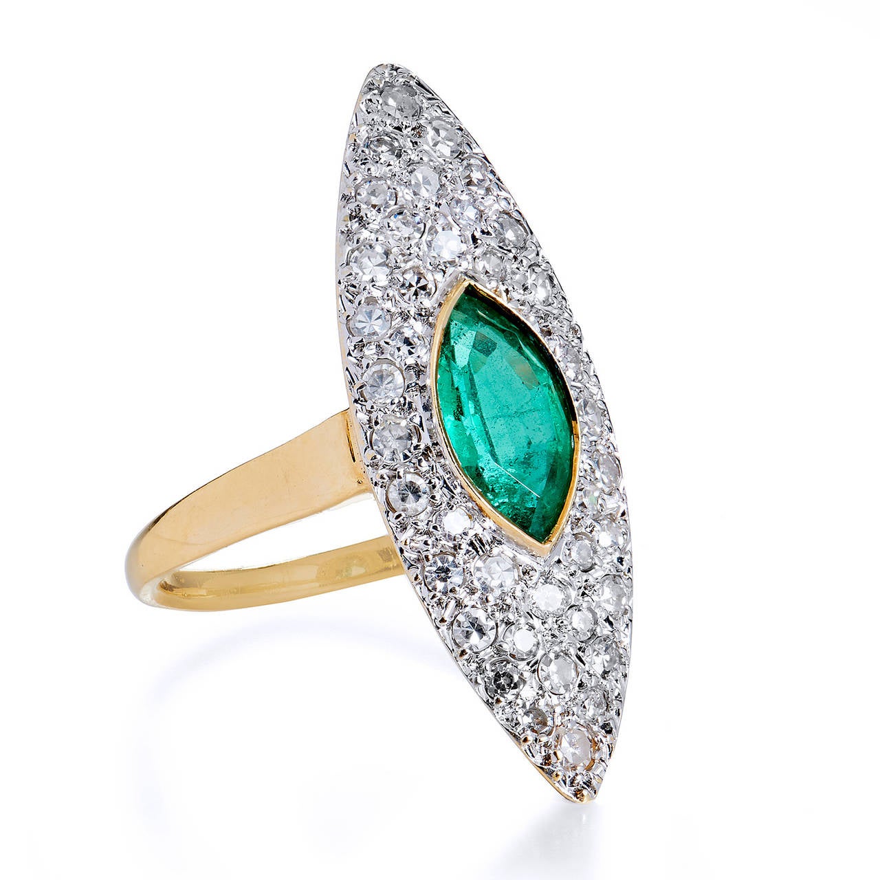 This Emerald eye emulates the enchantment and power of the most impressionable first, a gaze into a woman’s eye. Bejeweling the finger sits a bezel set Zambian emerald weighing approximately 1.10 carats (9.08 x 5 mm) submerged in 40 single cut pave