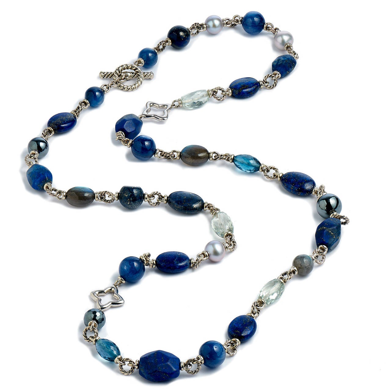 The colorful world of stones are storytellers, speaking to moods, personalities and tempos. This David Yurman sterling silver necklace features a restful palate of blue hues composed of lapis lazuli, labradonite, prasiolite, London blue topaz,