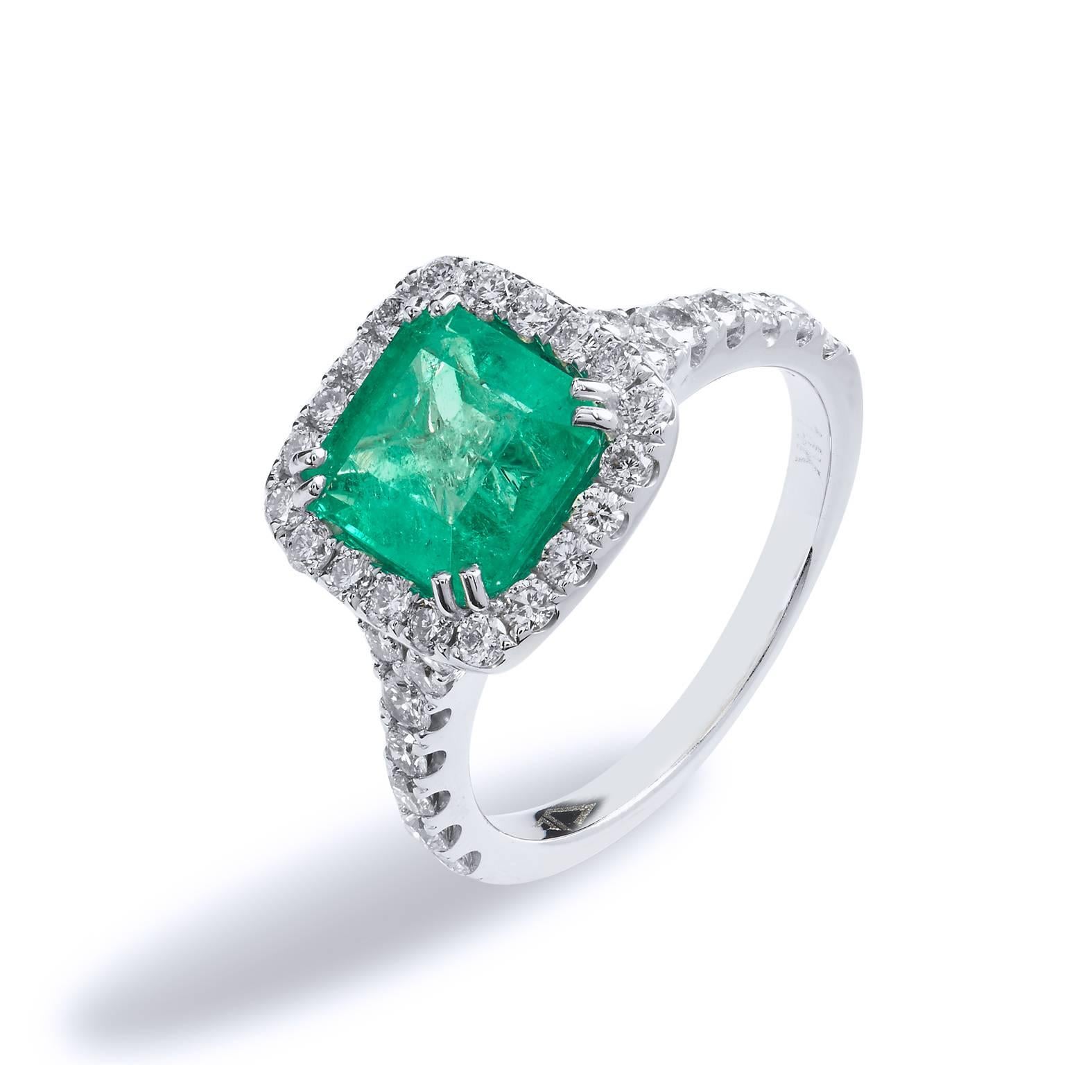With the gifting season approaching, this magnificent and timeless piece will seduce more than a smile when opened. Crafted in 14kt white gold, the ring features a 1.92 carat Colombian Emerald. The lively colored gemstone is accessorized by