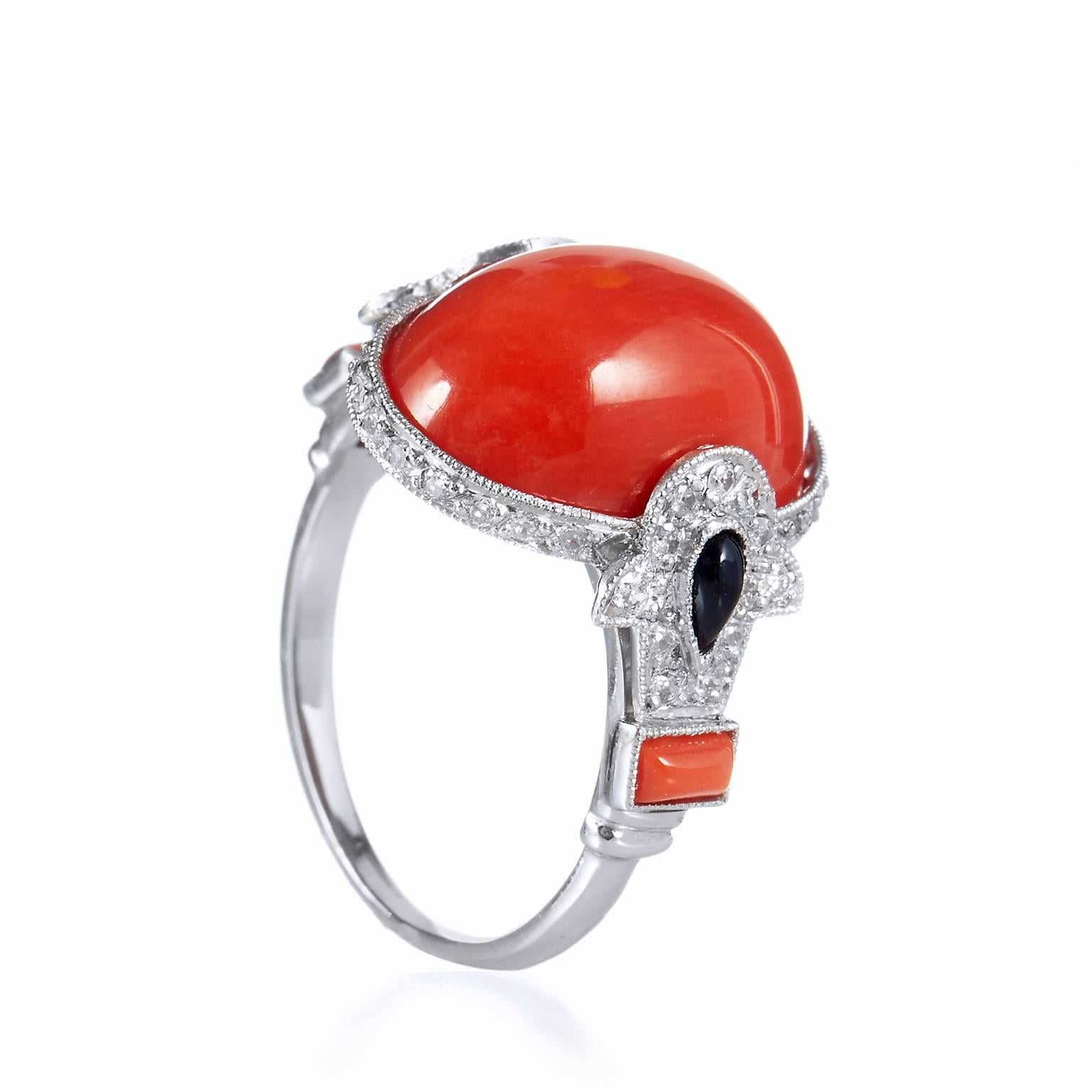 Art Deco Inspired 8.20 Carat Red Coral with Onyx Diamonds Set in a Platinum Ring

A beauty of the sea, coral is a precious gemstone that exhibits a variety of warm shades from pink to red and was exceptionally desired in the Victorian age and still