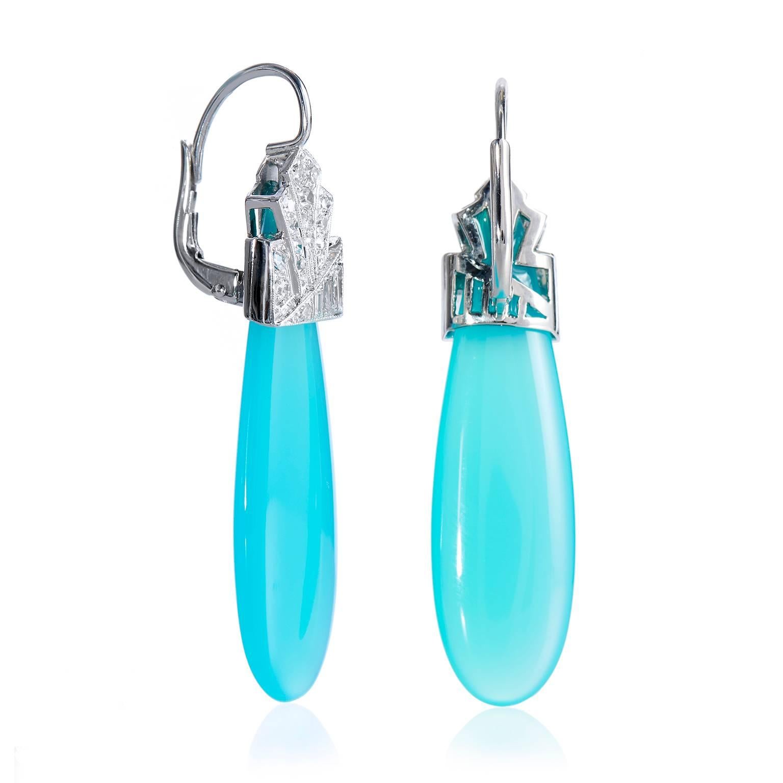 This set of platinum Art Déco style drop earrings are vibrant and playful with a dash of sophistication. The pair features Laguna Agate drops suspended by approximately .55cts of baguette and single cut diamonds.