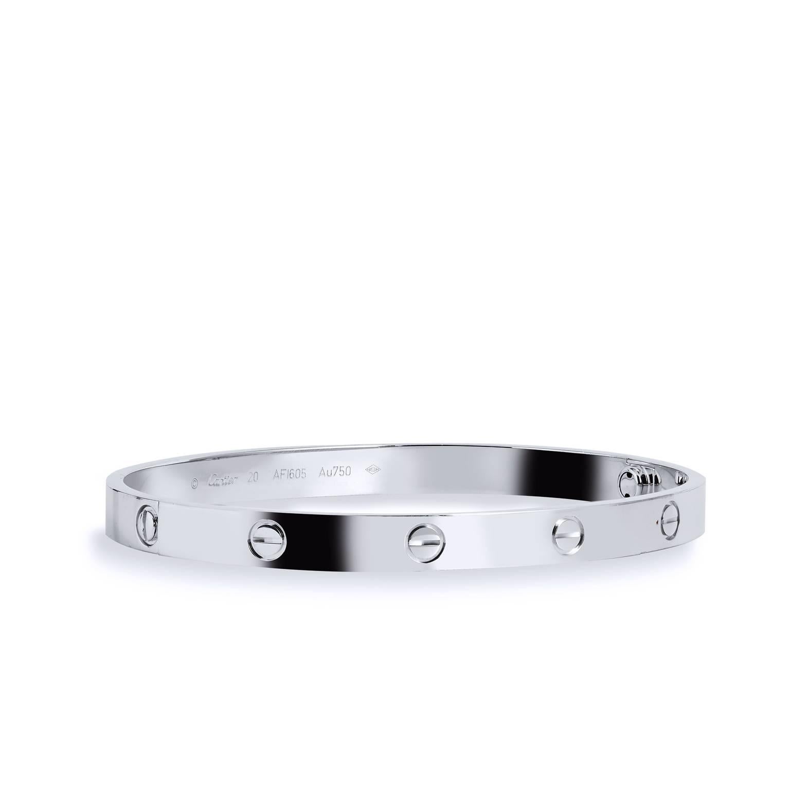 Effortlessly integrating strength and elegance, this bangle is a part of Cartier’s famous LOVE collection. This piece is crafted in 18kt white gold and features Cartier’s iconic screw motifs. It’s in excellent condition and comes with original box