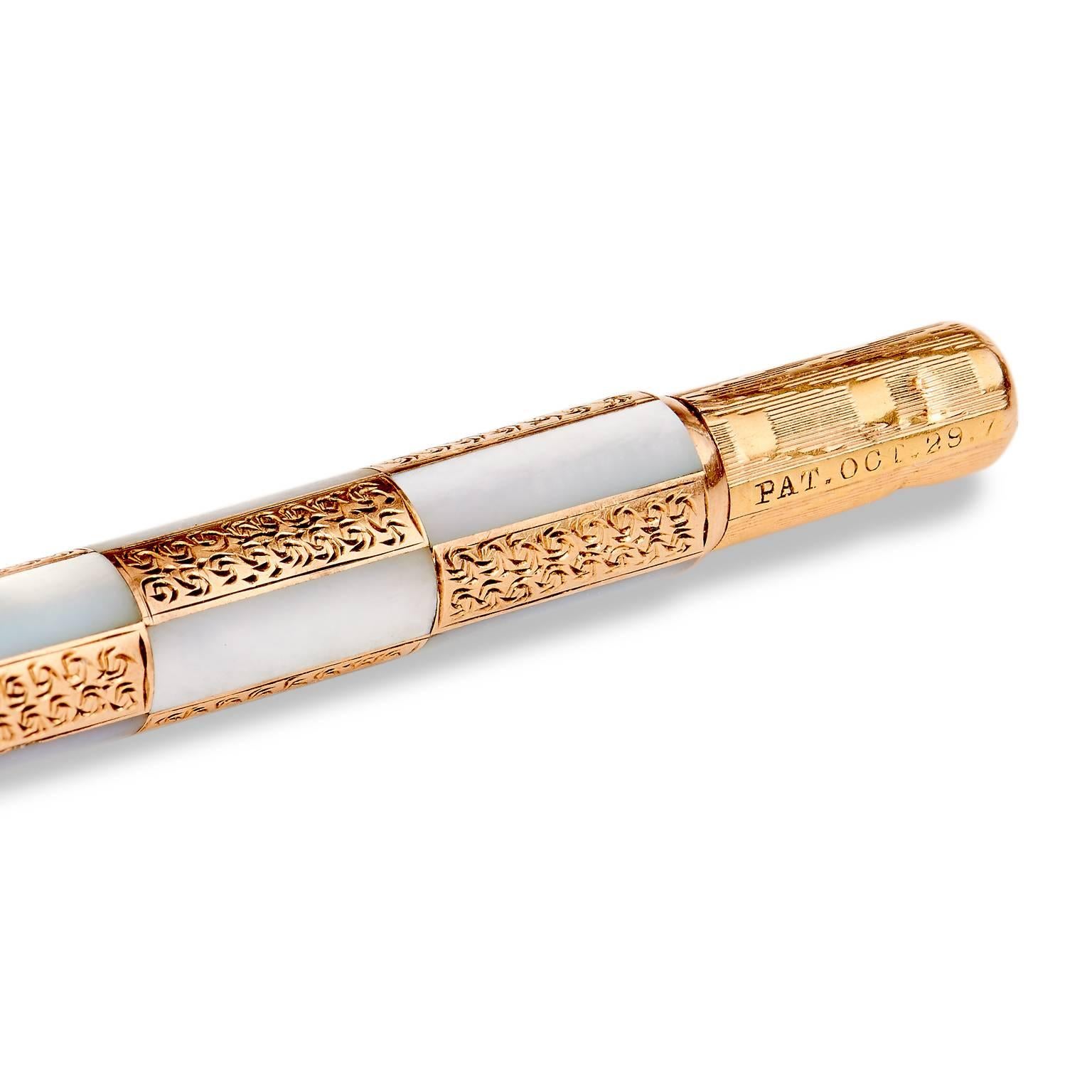  Crafted in 14kt rose gold, this toothpick features a checker design integrating mother of pearl with textured rose gold. 