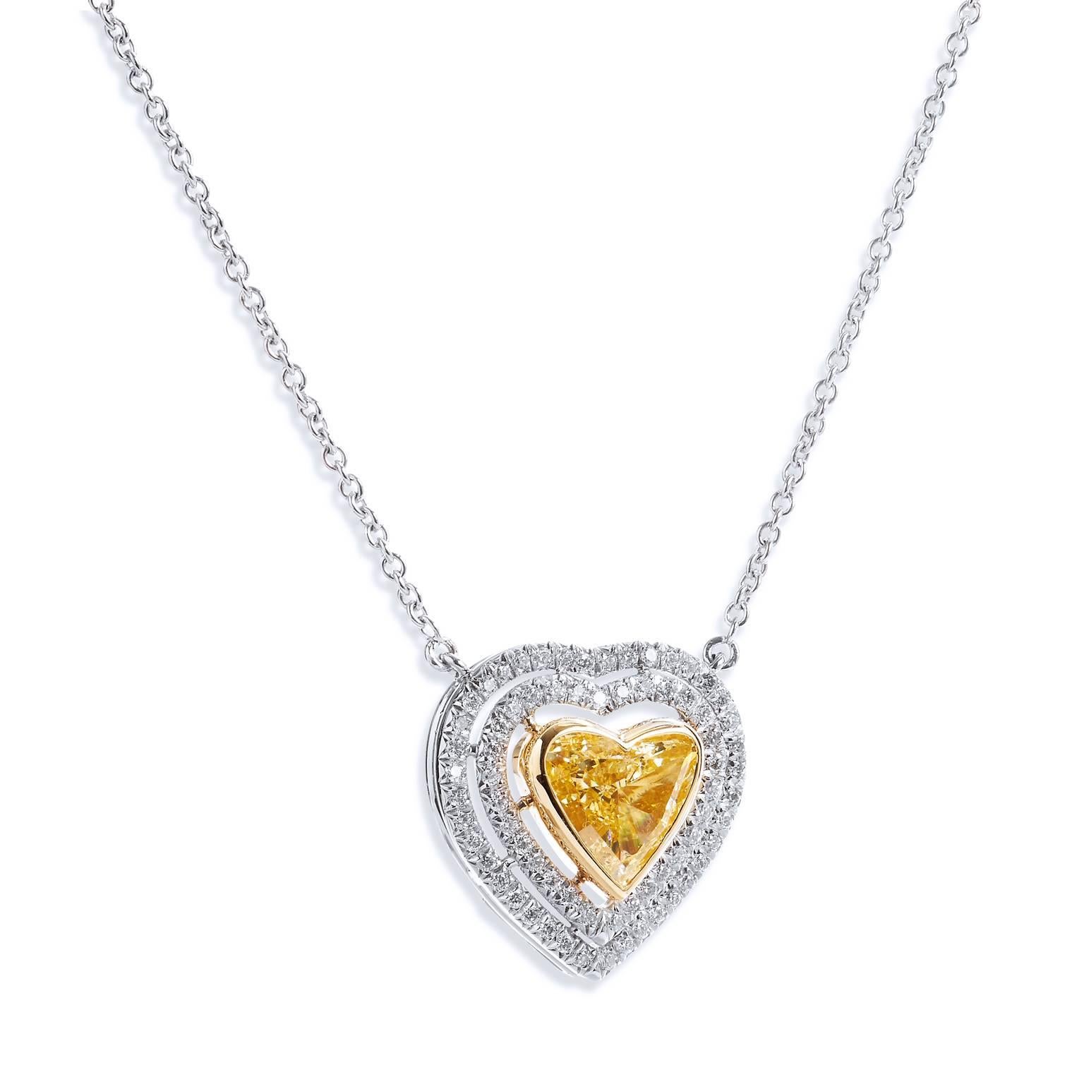 1.79 carat Natural Fancy Yellow Heart Shaped Diamond 18 karat White Gold Pendant

Handmade in 18kt white gold, this stunning pendant features an impressive 1.79ct SI2 natural fancy yellow heart shape diamond embraced by two layers of diamonds