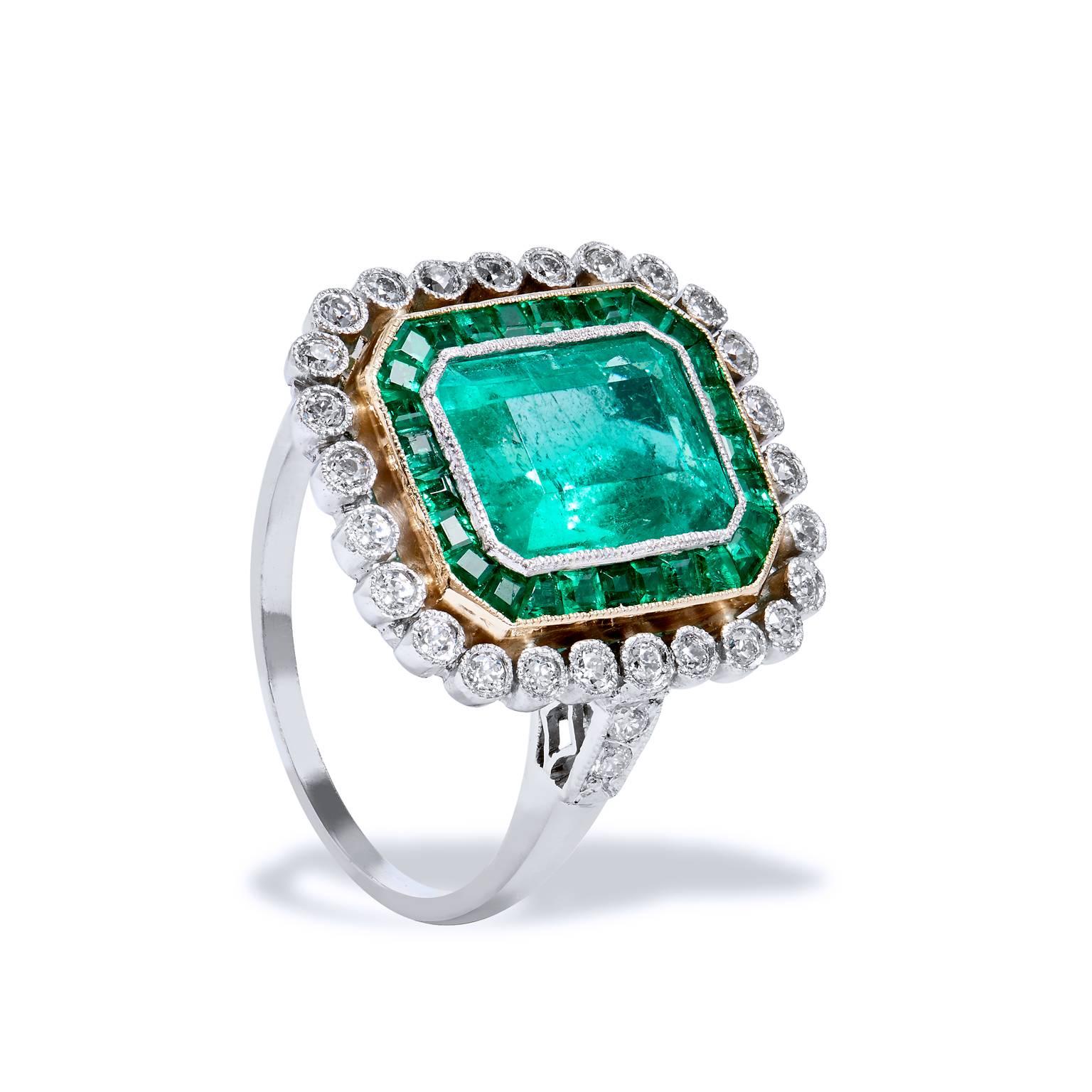 Channeling  the glamour and sophistication of Great Gatsby, this divine ring captures one’s attention with an impressive 2.75ct Colombian Emerald center gemstone.  Crafted in platinum with a soft touch of 18kt yellow gold that finely defines a
