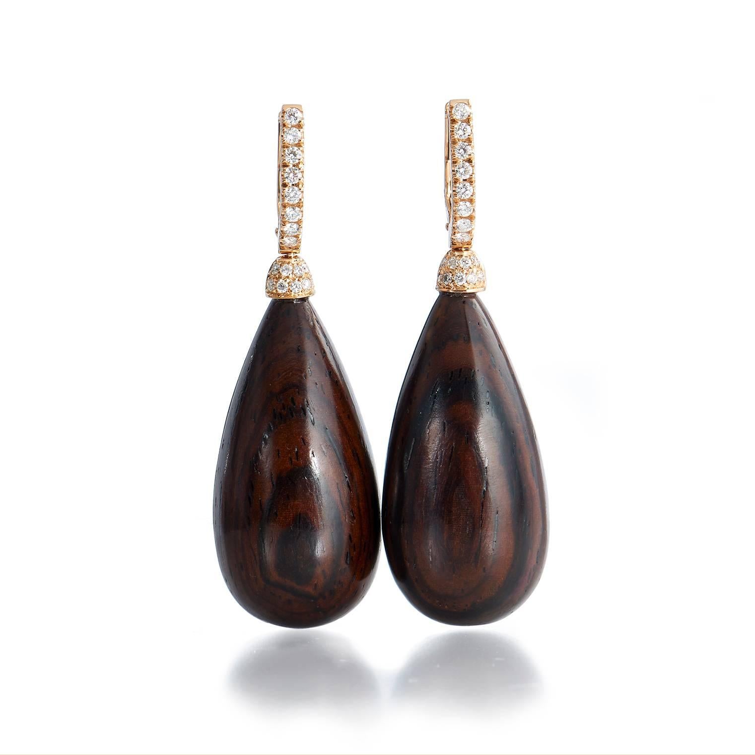 These 18 karat rose gold earrings are handcrafted by H&H Jewel and made from Cocobolo Wood.  

They measure 30 mm x 15 mm.  

The Cocobolo wood is suspended by .32 carats of G SI 1 pave set diamonds that line the 18 karat rose gold clasps. 

This