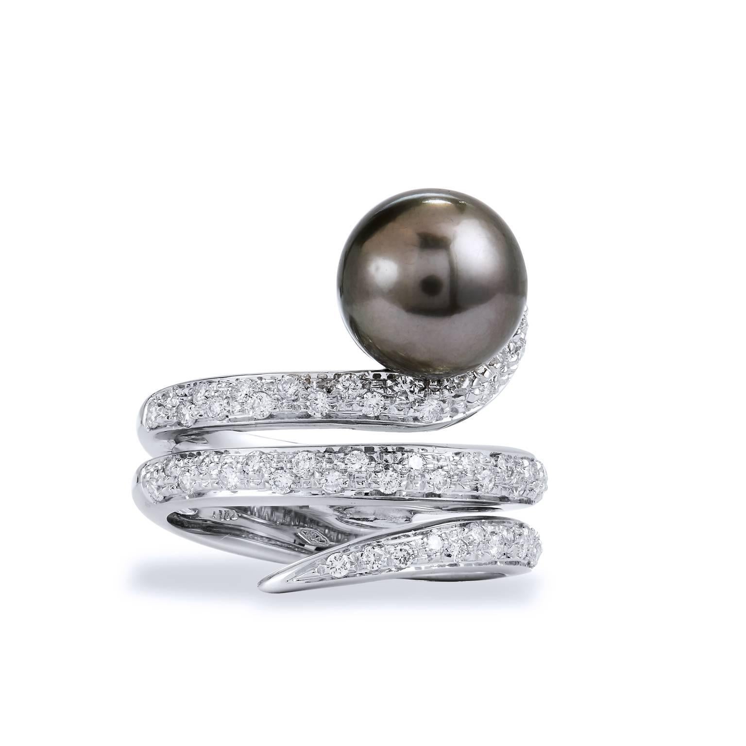 Spiral Tahitian Pearl and Diamond Pave 18 karat White Gold Ring Size 7

A truly unique design, this Italian diamond and pearl ring wraps the finger in .48ct of F/G VS2/SI1 diamond pave. 
At the pinnacle sits a gorgeous 9.80 mm Tahitian pearl. The