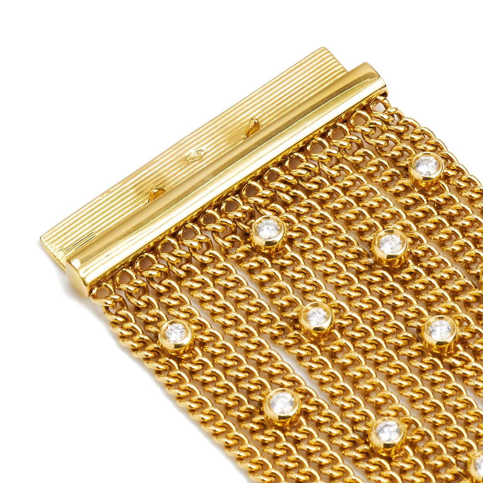 18K yellow gold Aspery & Guldag multi-strand bracelet with bezel set diamonds throughout and pavé diamonds at slide lock closure.