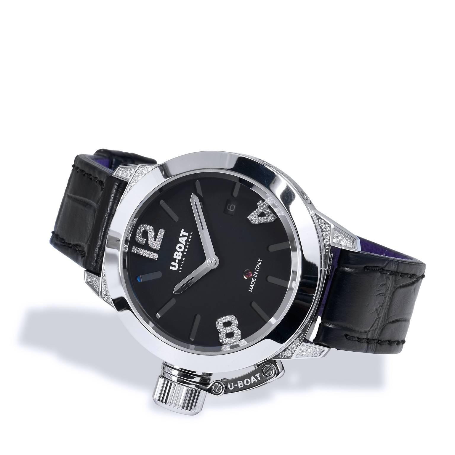 This Classico U-BOAT watch features a stainless steel case with a black dial that is adorned with diamond numbers and legs. The piece is complete with a black leather strap. New List Retail Price is $5,350. Our price is $4,280