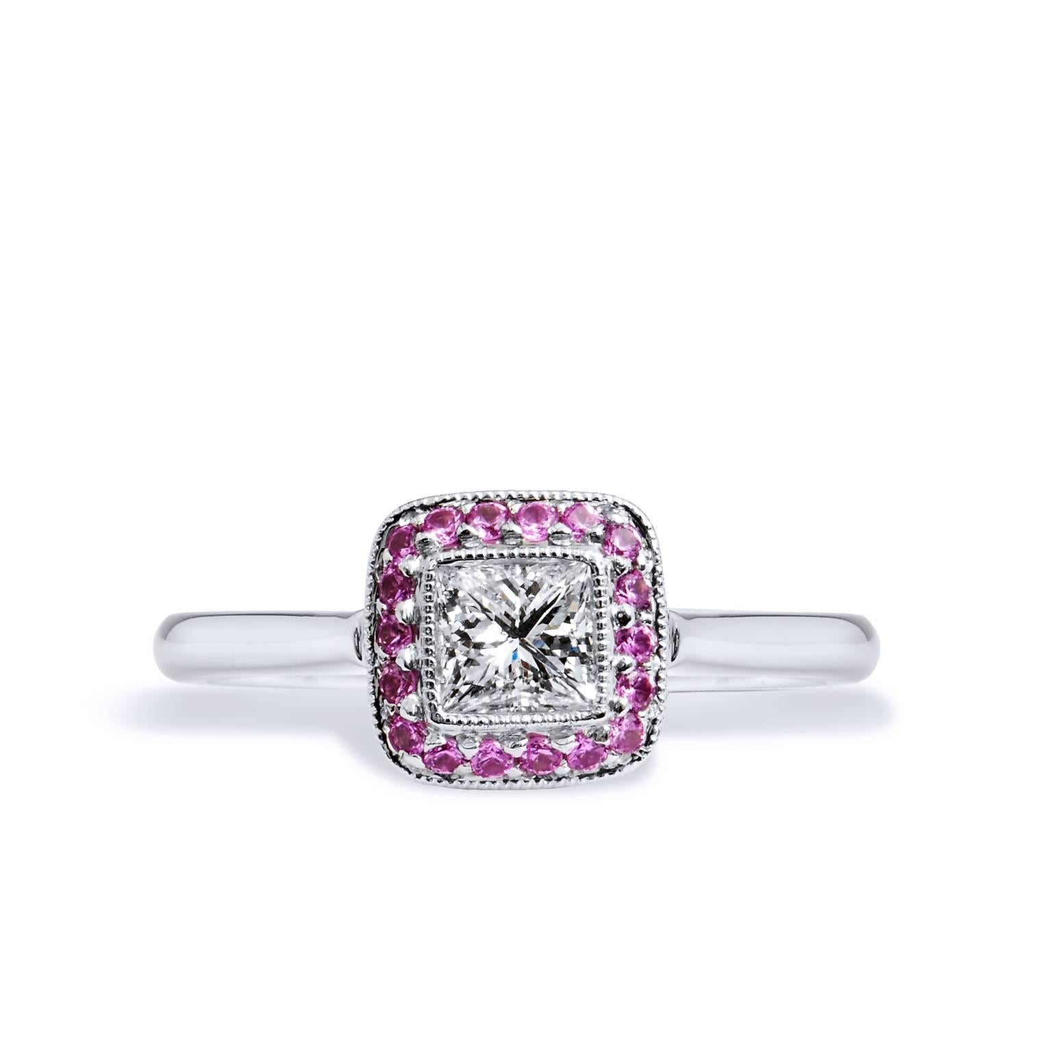 Handmade Diamond and Pink Sapphire Halo 18 karat White Gold Engagement Ring

Handcrafted in 18 karat white gold, this ring features a .40 carat E-F SI2 graded diamond. The center diamonds is embraced by 18 piece pave set natural hot pink sapphires.